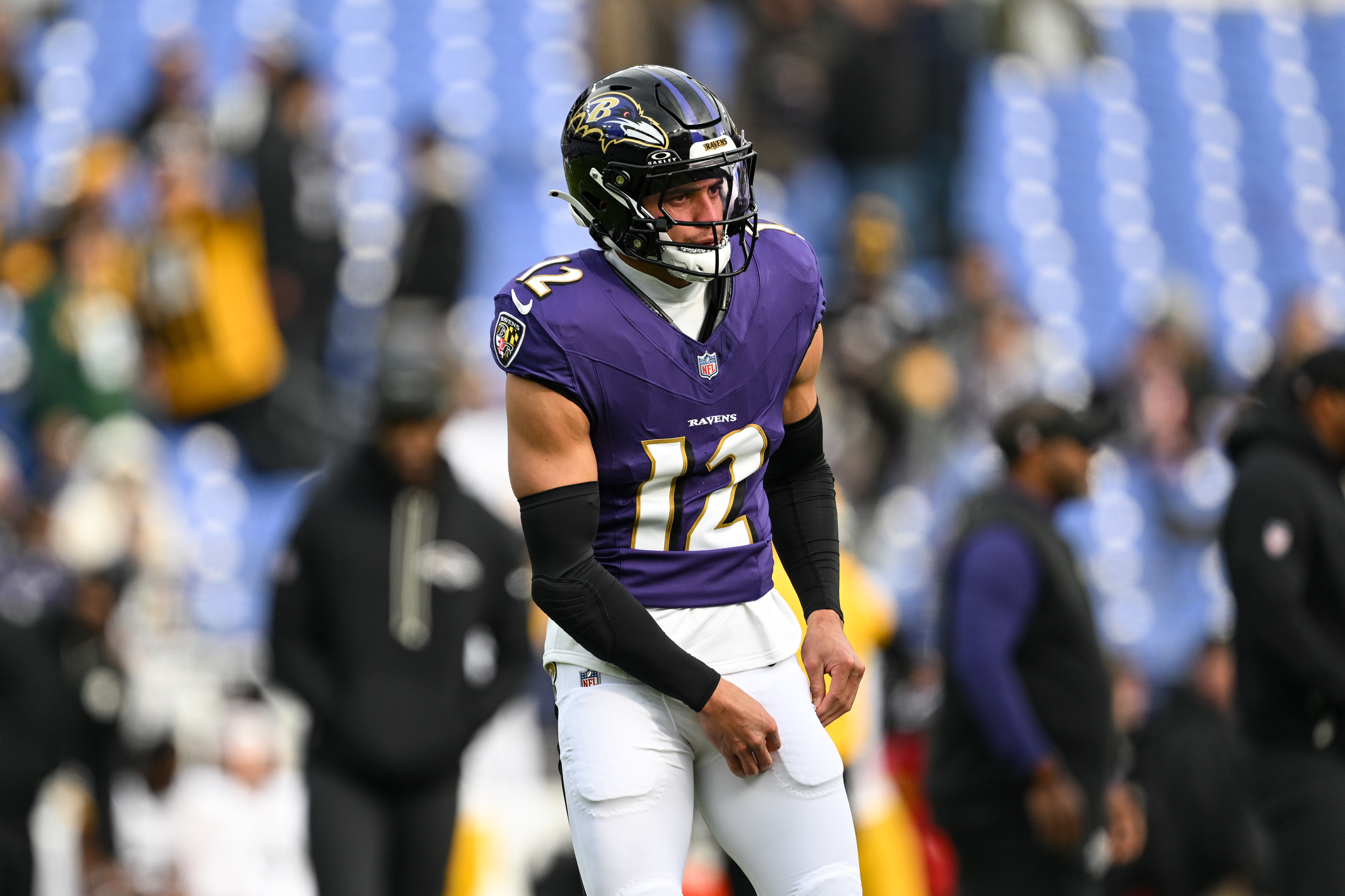 Baltimore Ravens safety Alohi Gilman (12) looks on during pre-game warm-ups before an NFL football game against the Pittsburgh Steelers, Sunday, Dec. 7, 2025, in Baltimore.