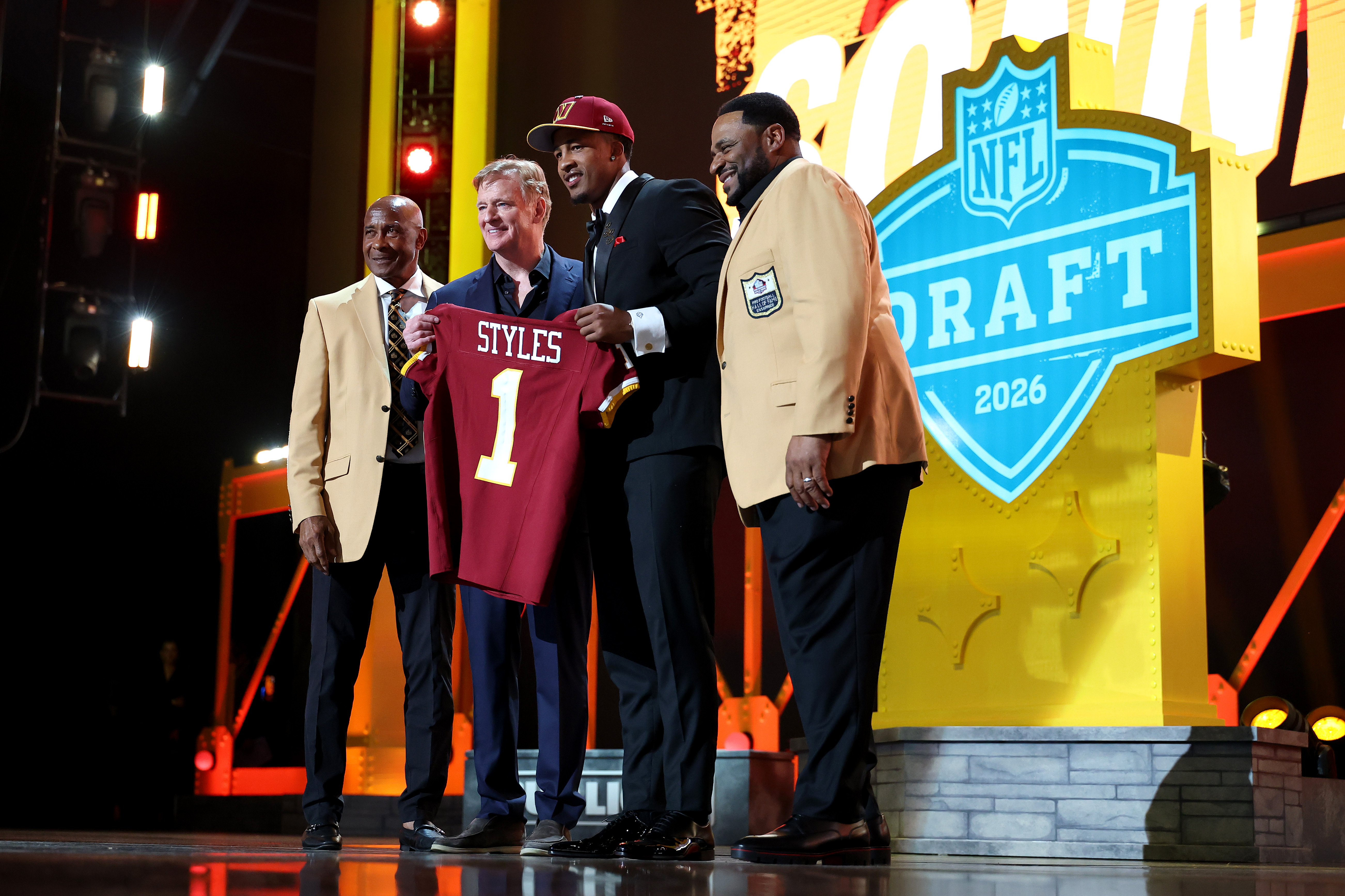 Sonny Styles (2R) of Ohio State poses with NFL Commissioner Roger Goodell (2L), Lynn Swann (L) and Jerome Bettis (R) after being selected seventh overall pick by the Washington Commanders during Round One of the 2026 NFL Draft at Acrisure Stadium on April 23, 2026 in Pittsburgh, Pennsylvania.