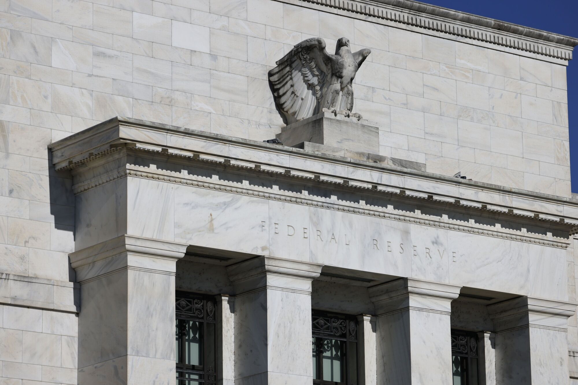 Two Fed hawks say more hikes in…