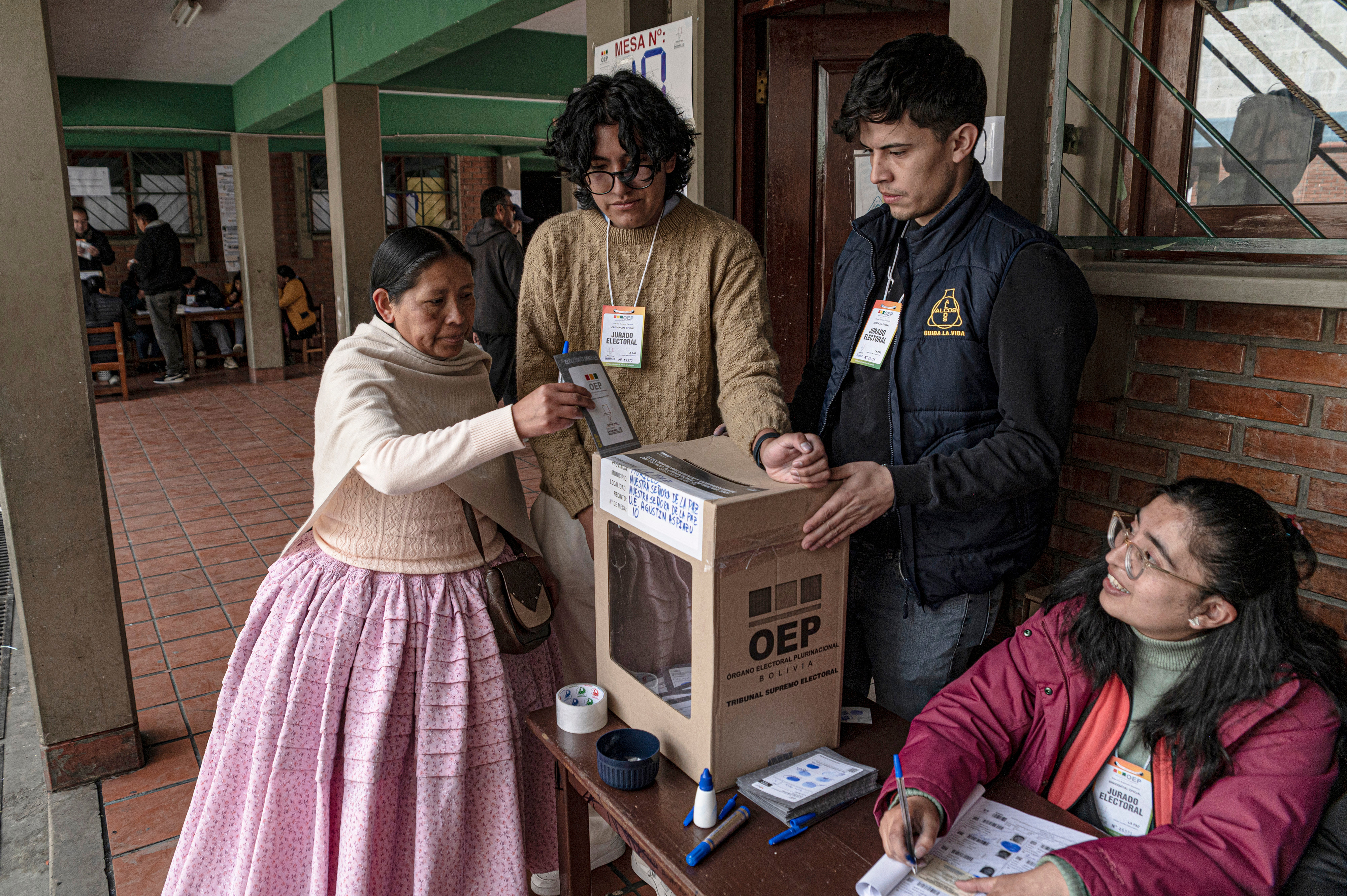 A voter casts a ballot at a polling station during the runoff presidential election in La Paz, Bolivia, on Sunday, Oct. 19, 2025. Bolivians are voting in a presidential runoff to decide which of two pro-business candidates they trust to lead them out of their deepest economic crisis in forty years. Photographer: Marcelo Perez del Carpio/Bloomberg