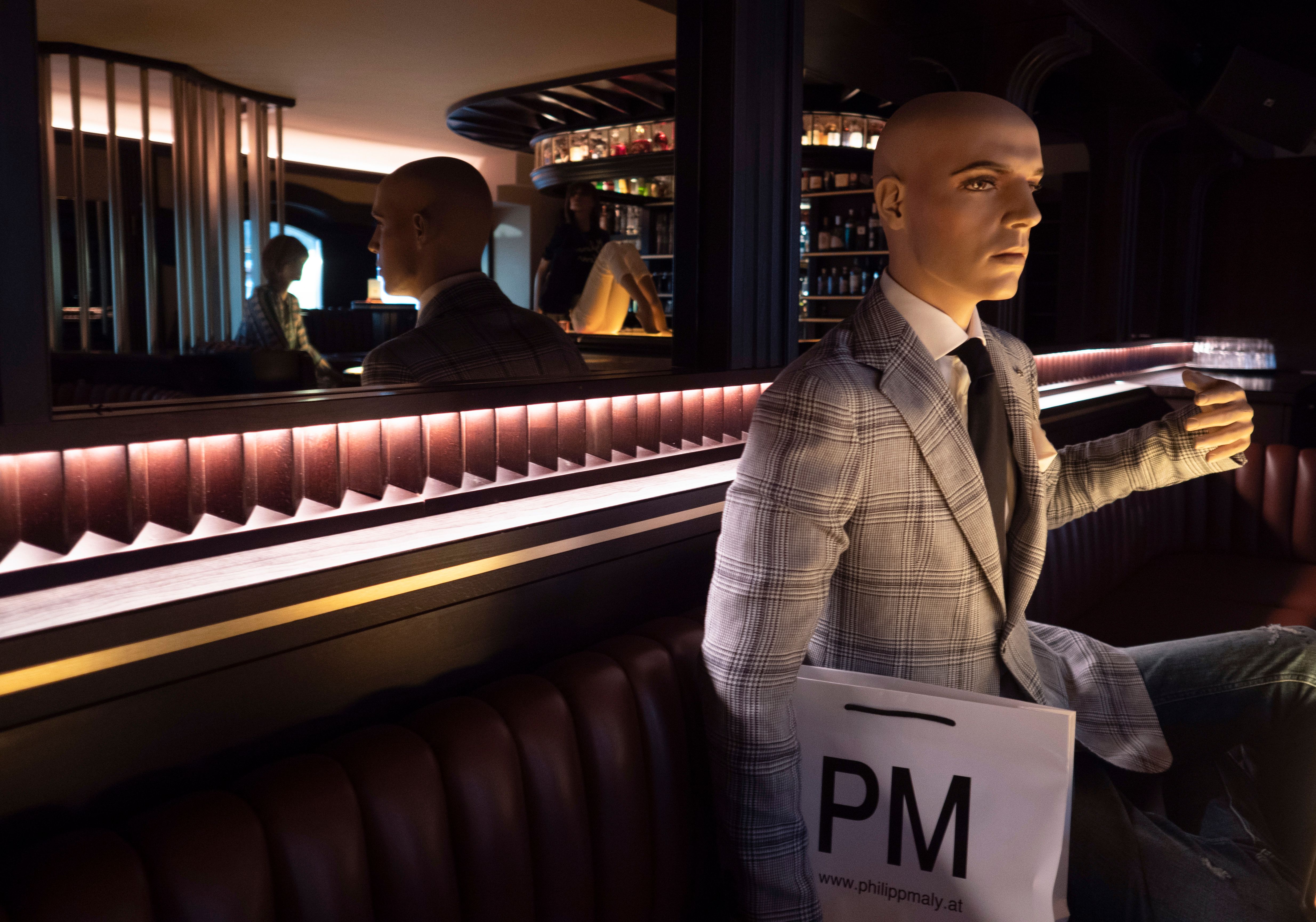 Mannequins are placed at a table of a bar in Vienna to help customers keep the social distancing rules on May 15 as Austria reopened all cafes and restaurants.