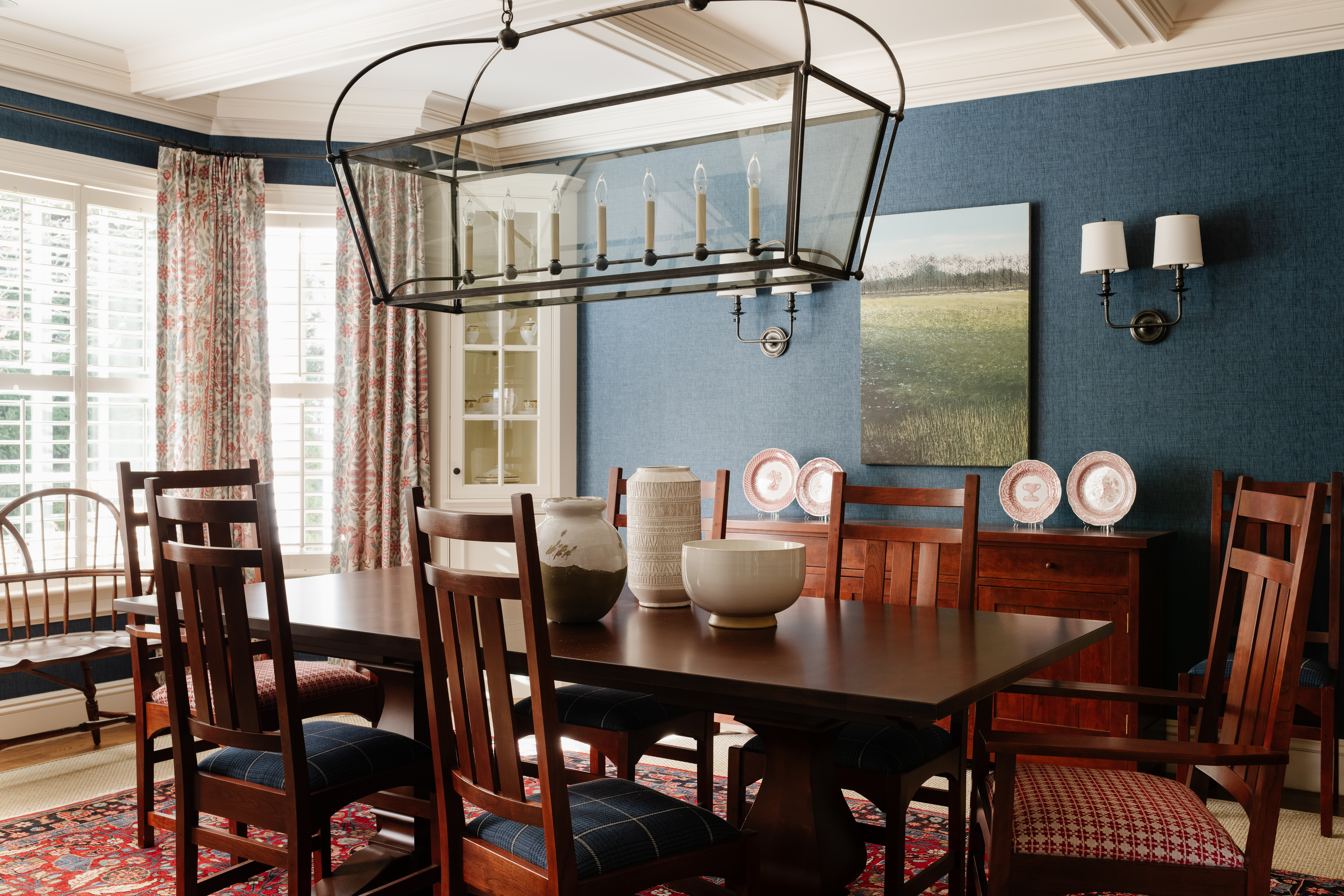 Their art consultant hung several paintings by Benoit Trimborn from M Fine Arts Galerie in Boston, including this winter scene in the dining room.