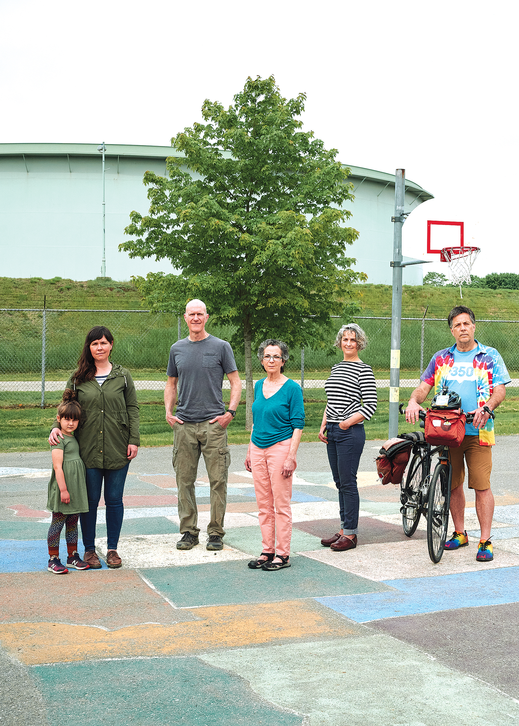 From left, Concerned South Portland residents Ashley Shoukimas and her daughter, Scout, David Falatko, Roberta Zuckerman, Pamela Cragin, and Bob Klotz at James Otis Kaler Elementary School on May 22.