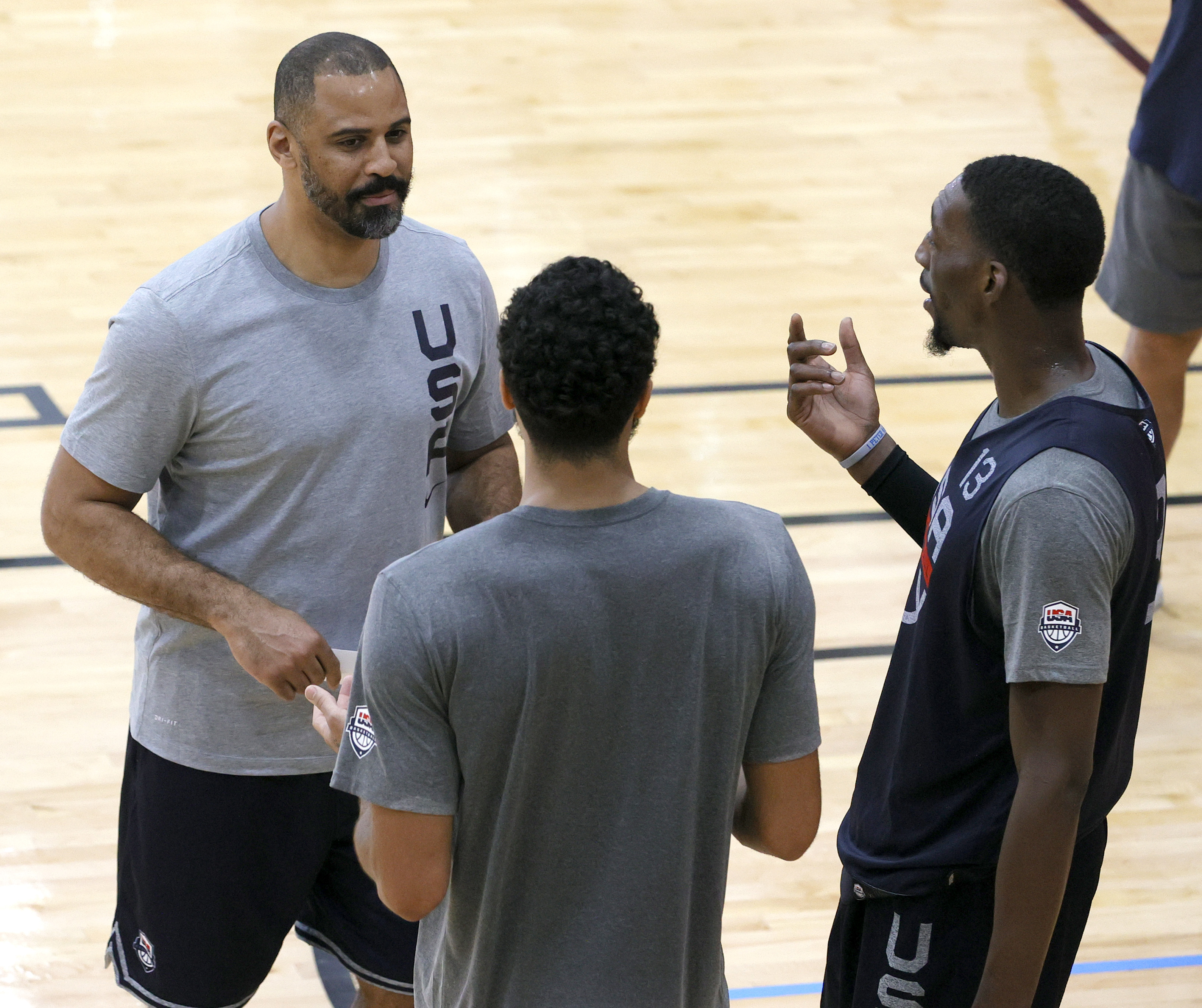 Team USA assistant coach Ime Udoka (left) talked with Jayson Tatum (center) and Bam Adebayo during a practice Wednesday.