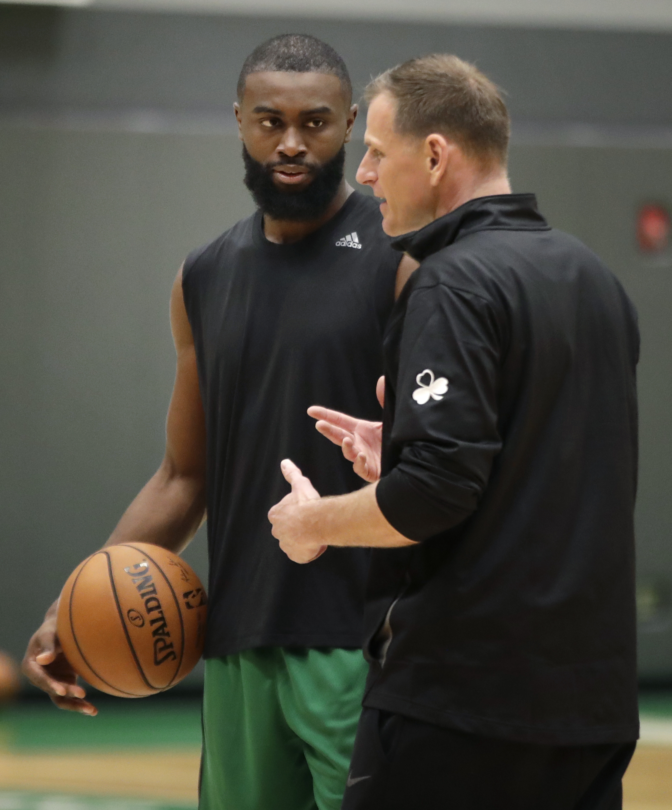 Celtics assistant coach Jay Larranaga (right), pictured with Jaylen Brown, said players who have come to the team's training facility in the past week have been in excellent shape, despite the long layoff.