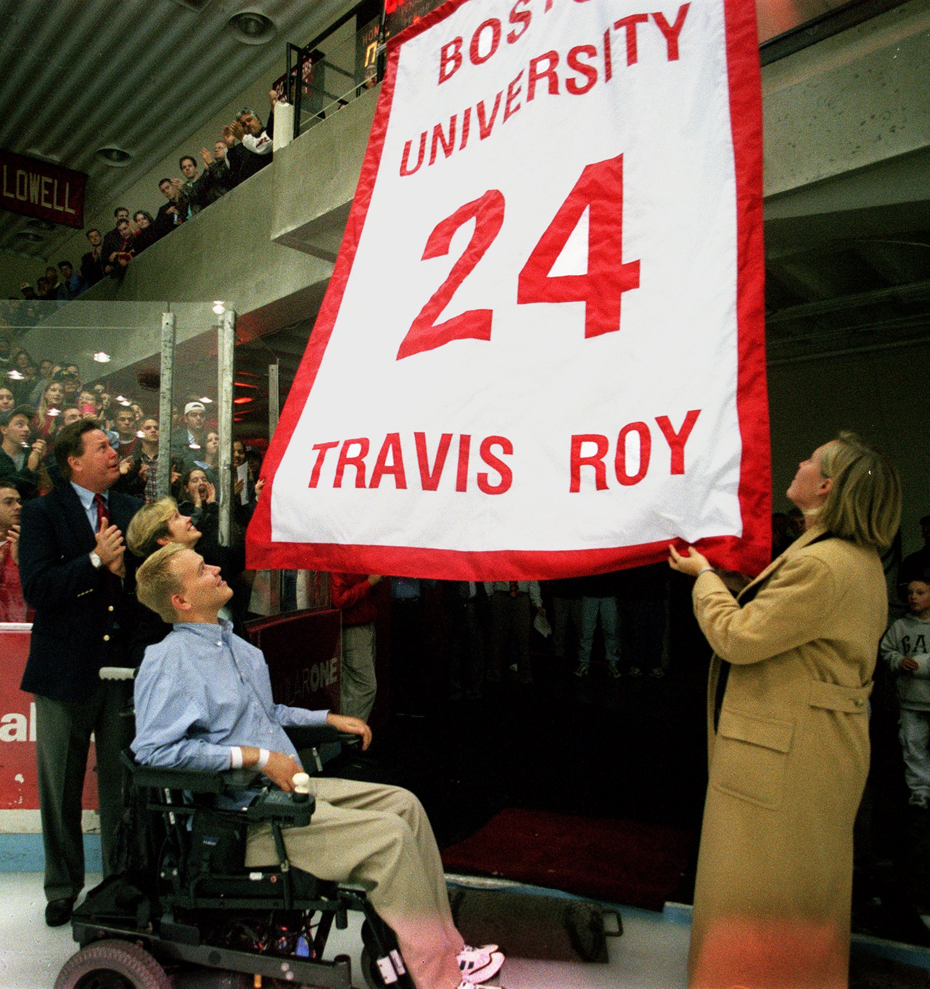 The Roy family watched as Travis Roy's number was retired at BU in 1999.