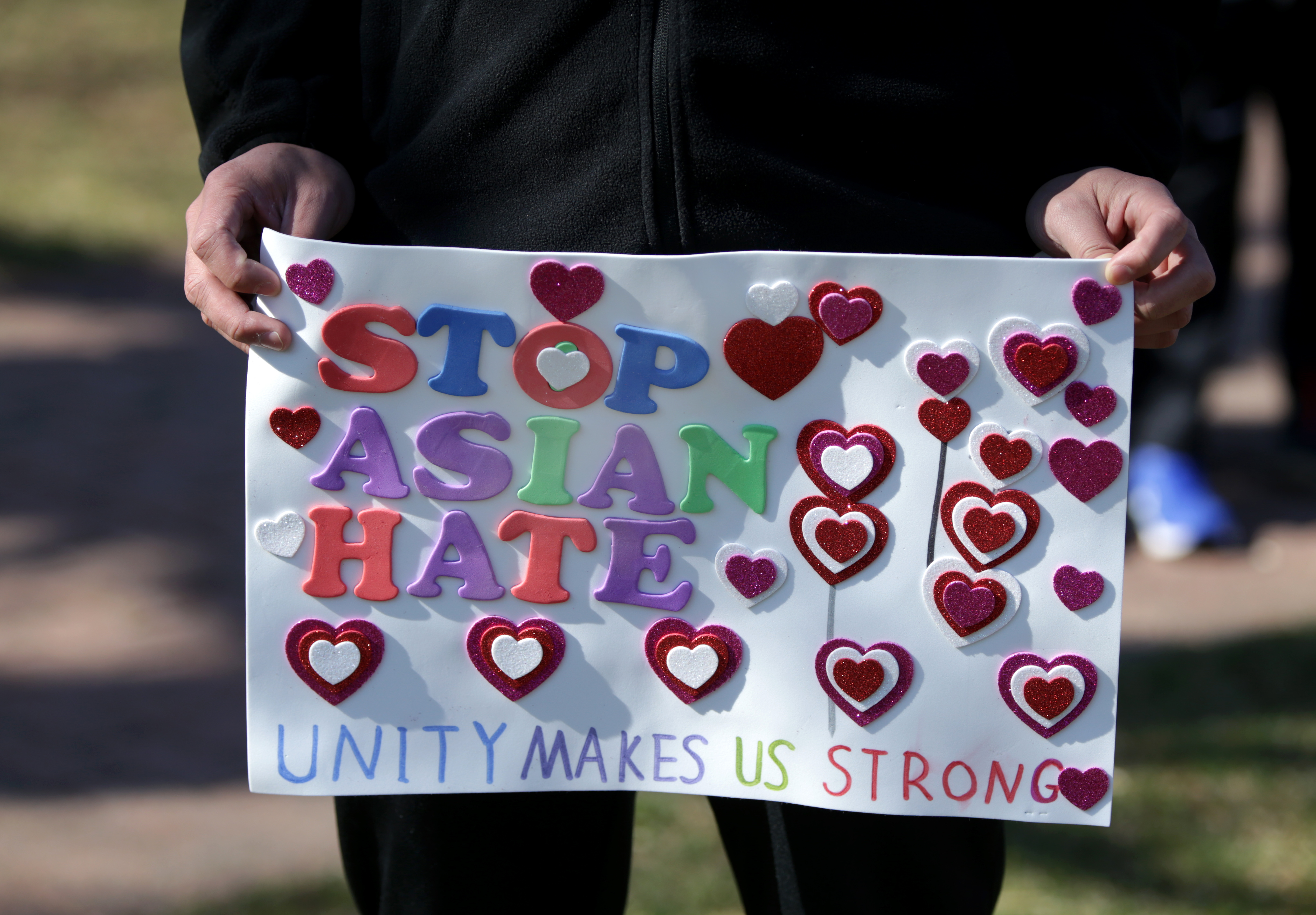 One of the signs at the Rally & Run To Stop Asian Hate in Hopkinton.