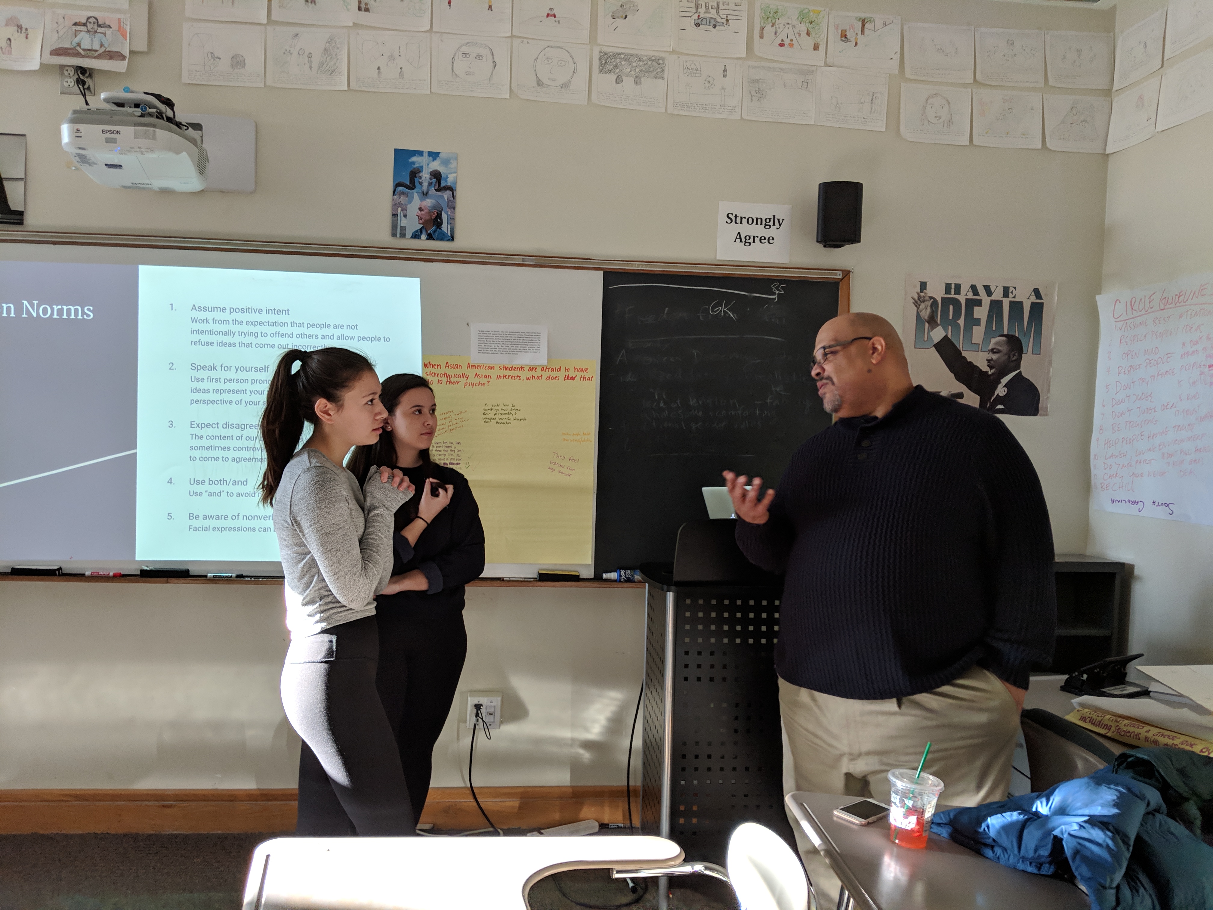In 2018, Cawthorne advises students Satchel Tsai (far left) and Ellora Daley before they lead a peer workshop called “Asian Americans and Affirmative Action,” about the debate over race-based admissions at Harvard University.