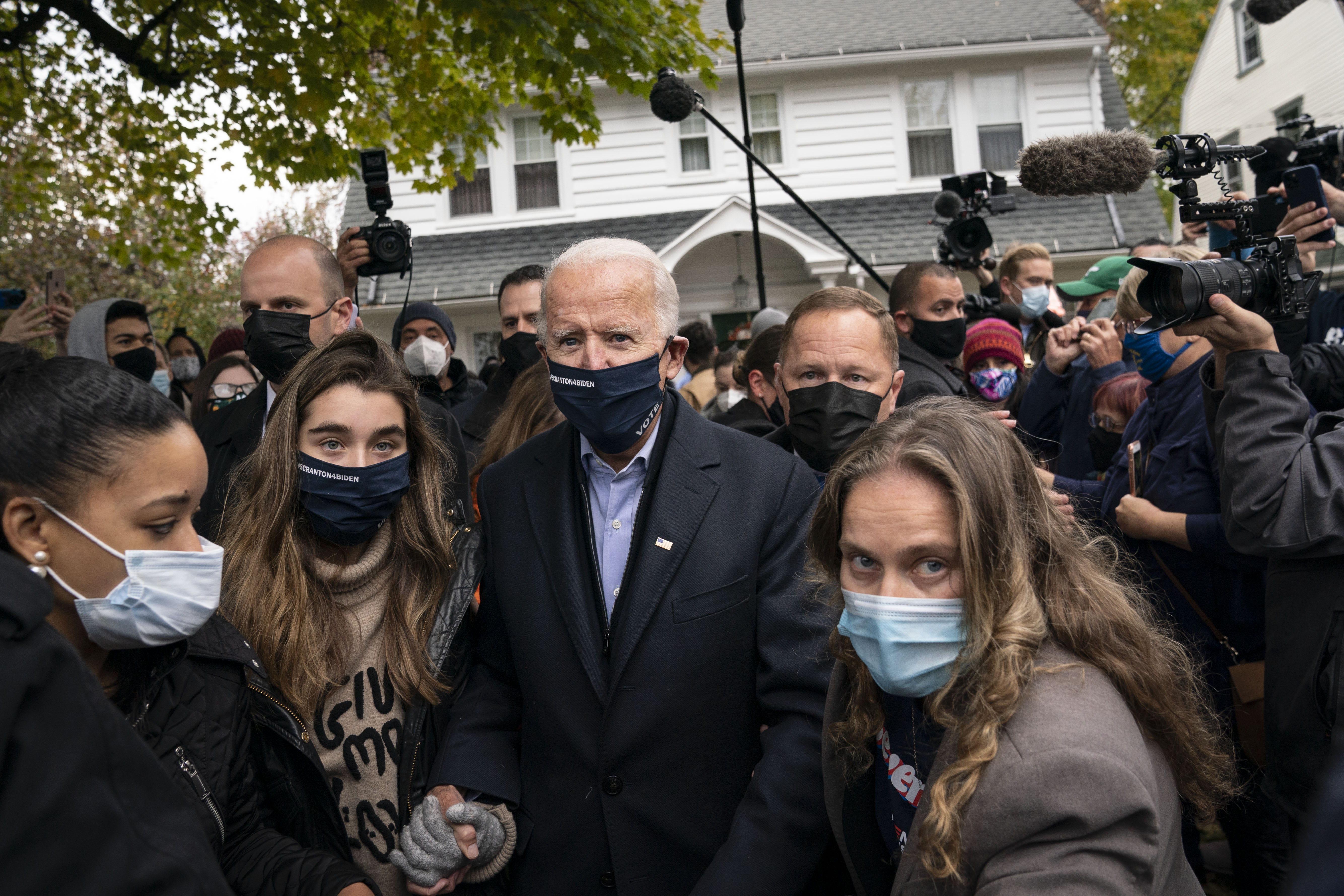 Annie Tomasini, right, accompanied Democratic presidential nominee Joe Biden as he visited a neighbor's house in his hometown of Scranton, Pa., on Election Day.