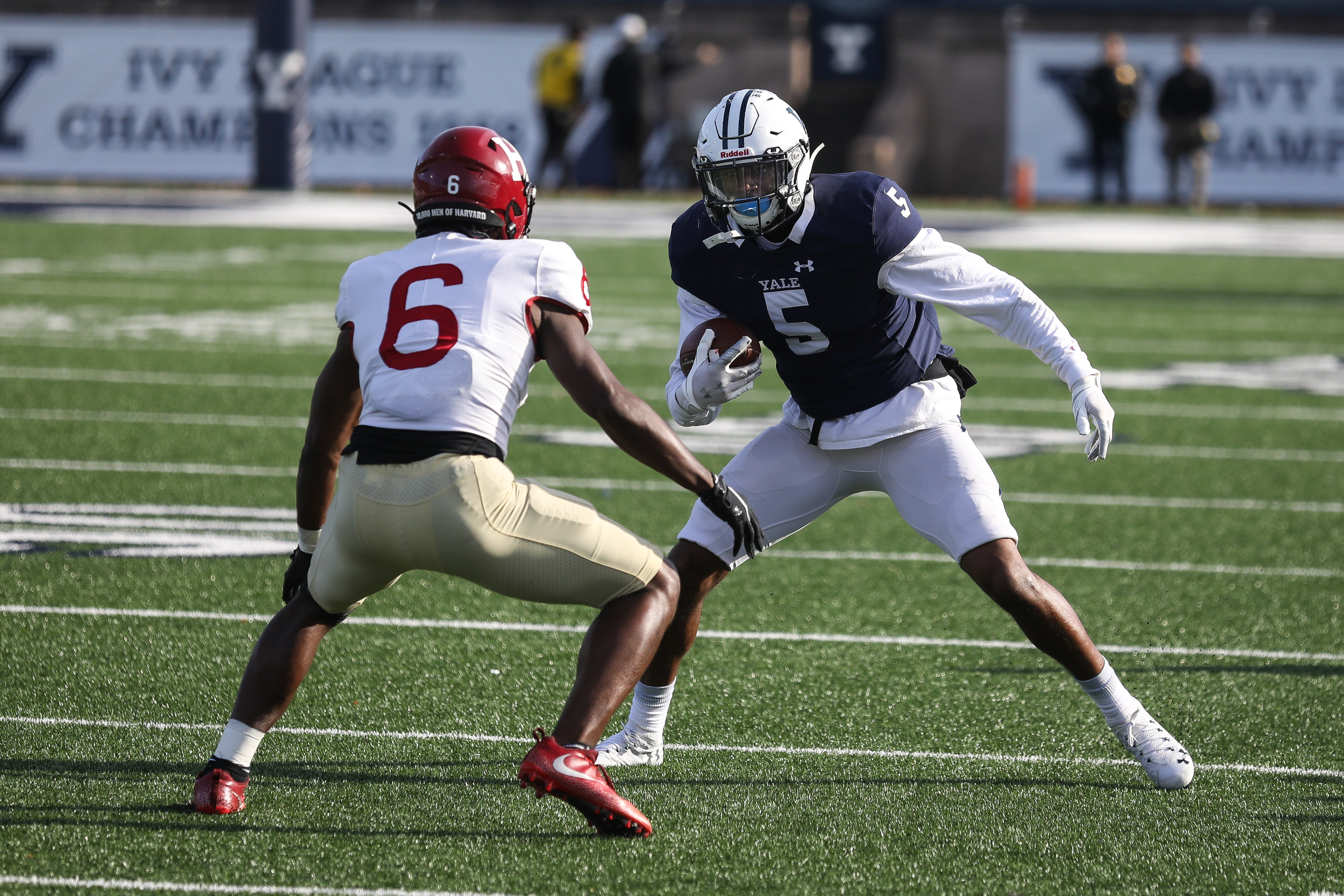 Yale senior Jaylan Sandifer looks for a way around Harvard cornerback Khalid Thomas during the second quarter.