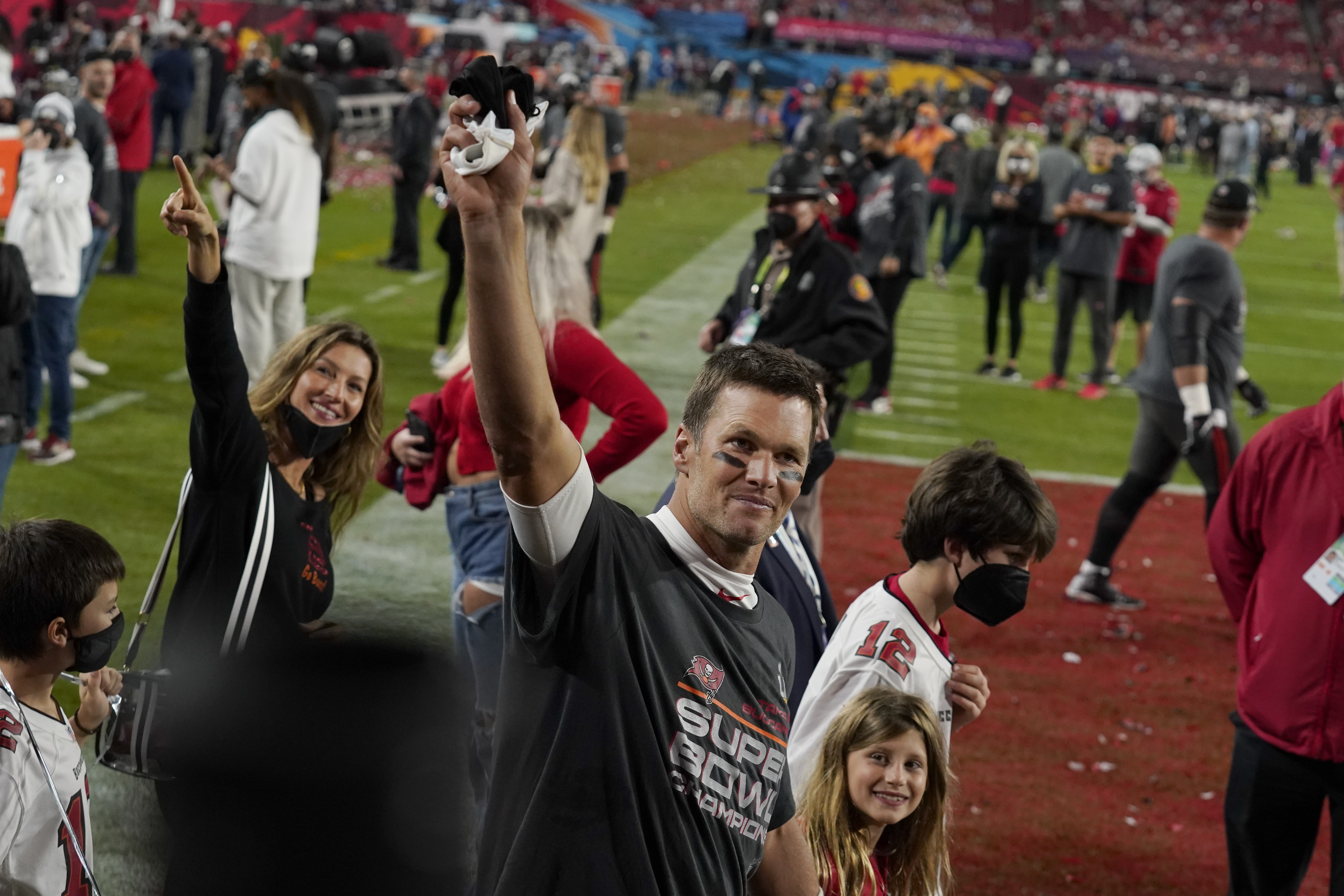 Tom Brady walks off the field with his wife, Gisele Bundchen and their family after the Super Bowl.