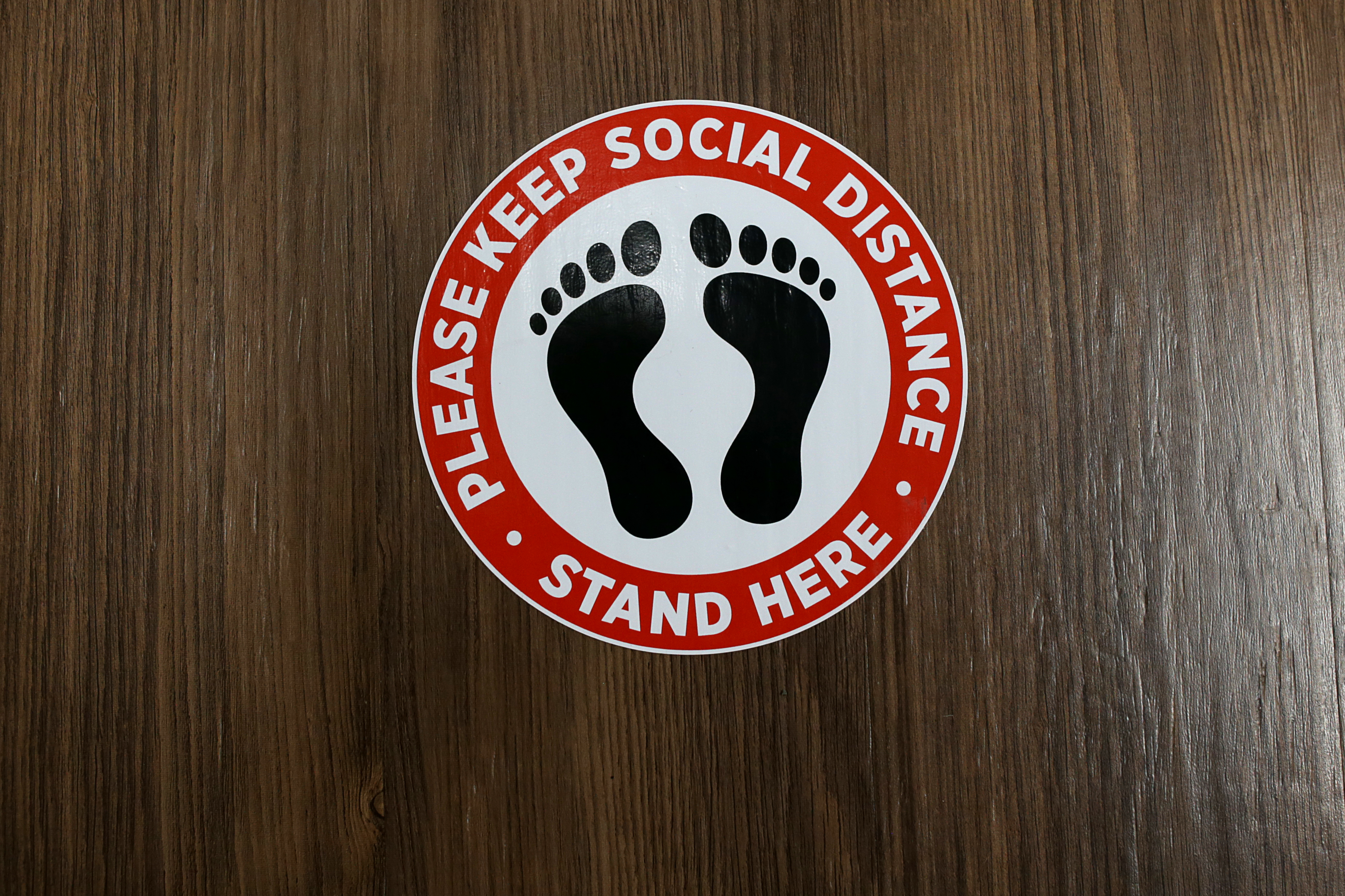 The LGA company inside Cummings Properties business complex has social distancing markers on the floor in Woburn.