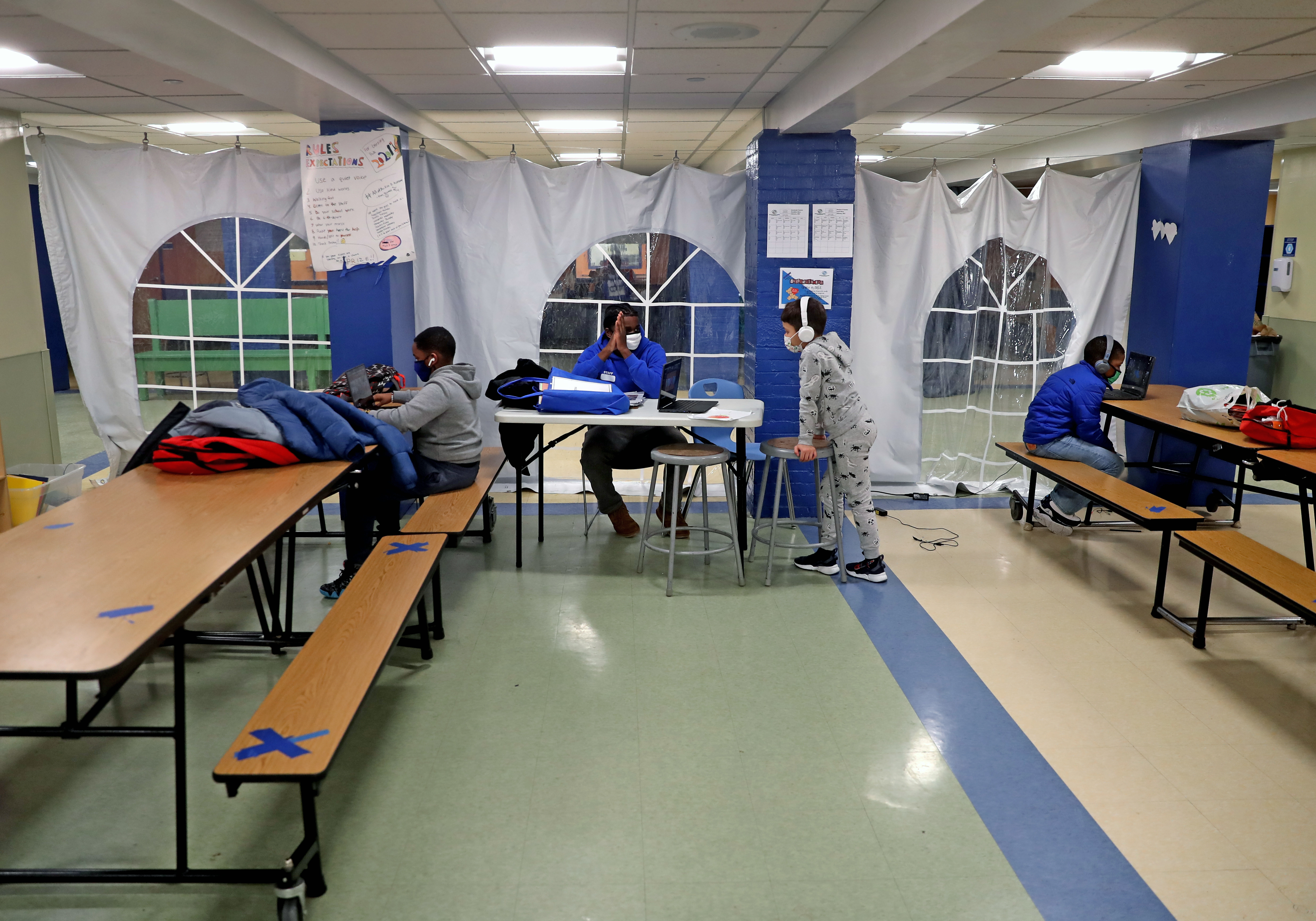 Children participate in small learning pods at the the Boys & Girls Club of Metro South in Brockton.