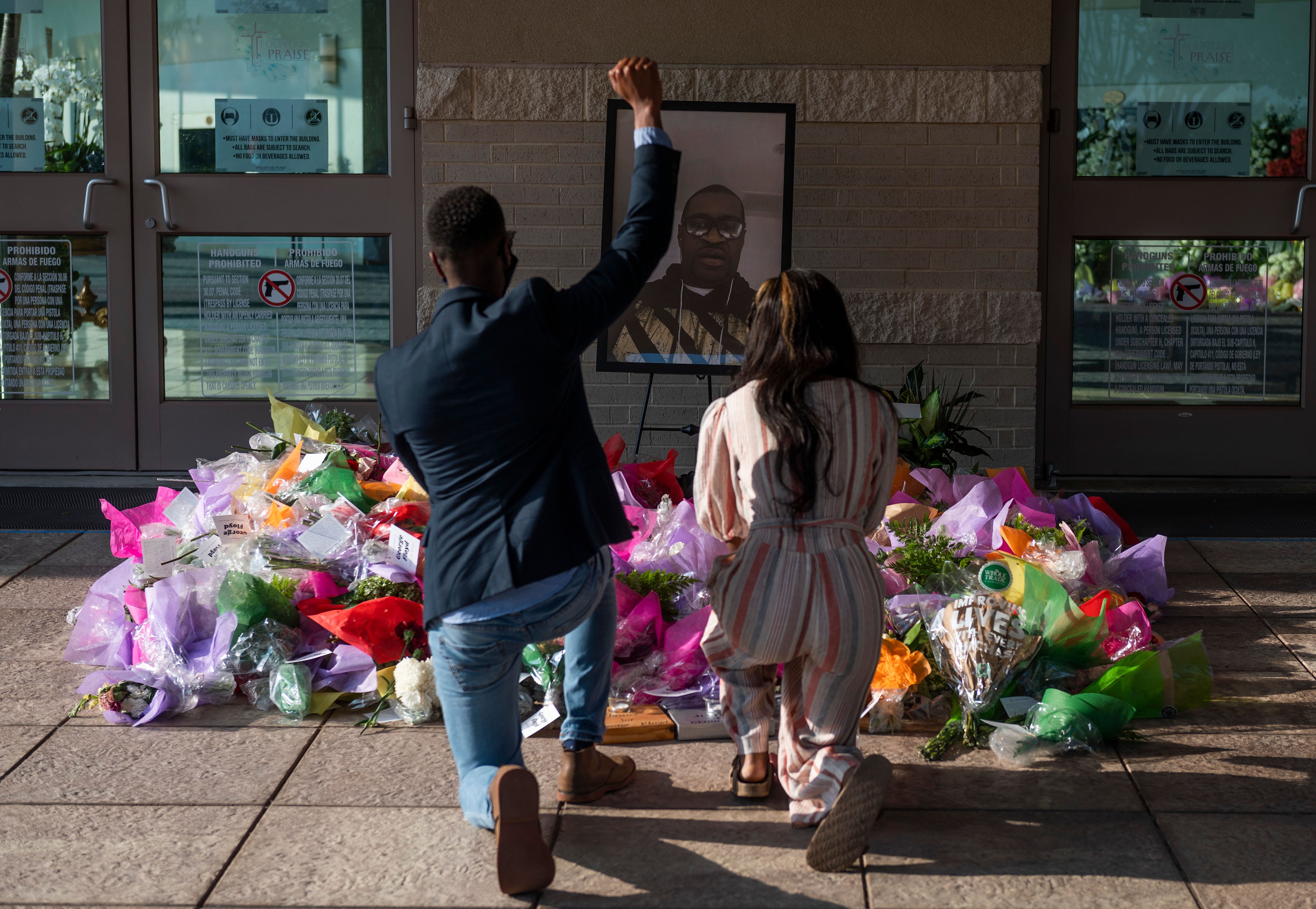 Guests paid their respects at a memorial before the coffin arrived for the funeral for George Floyd.