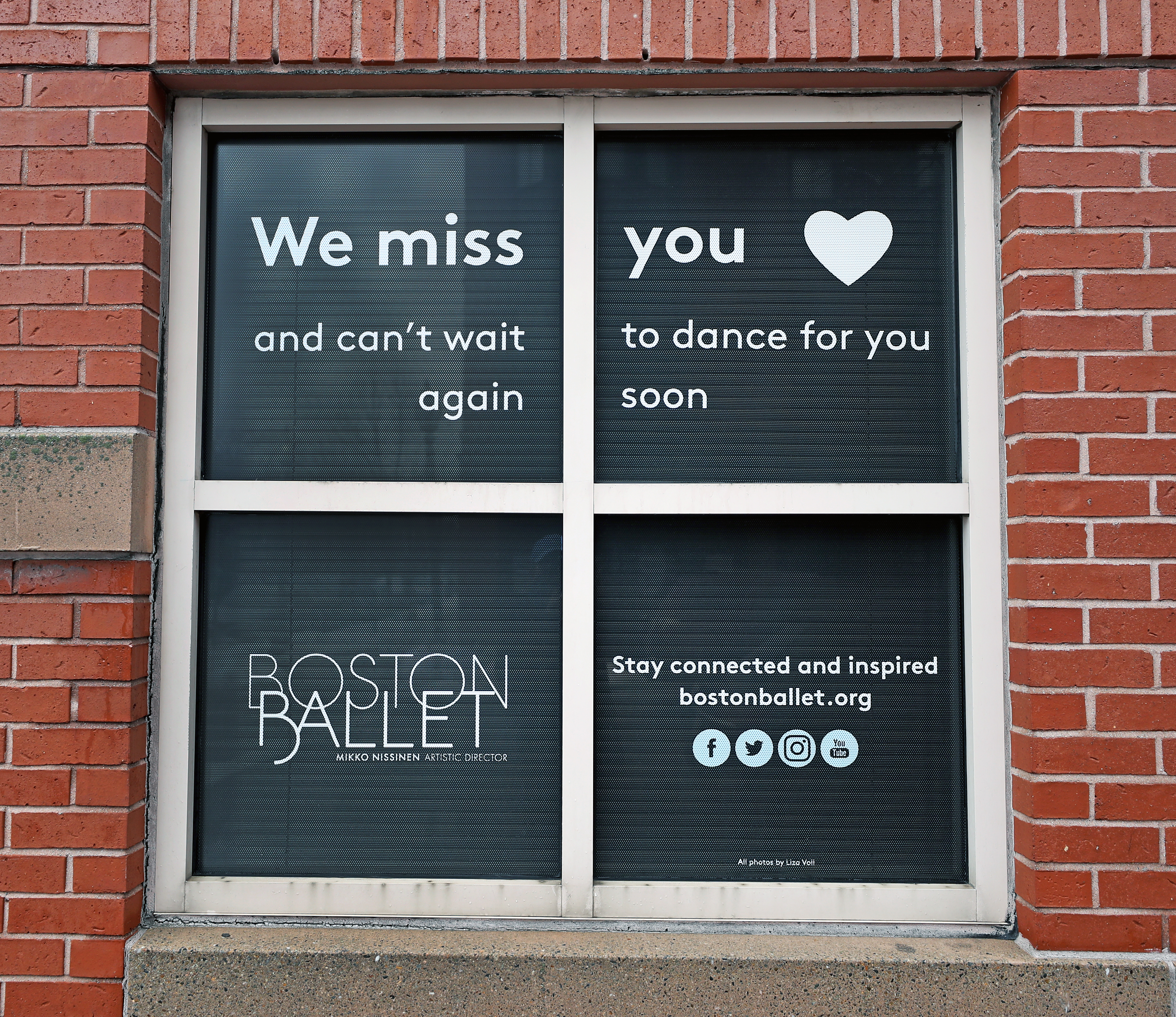 A message in the windows of the Boston Ballet School on Clarendon Street in Boston.