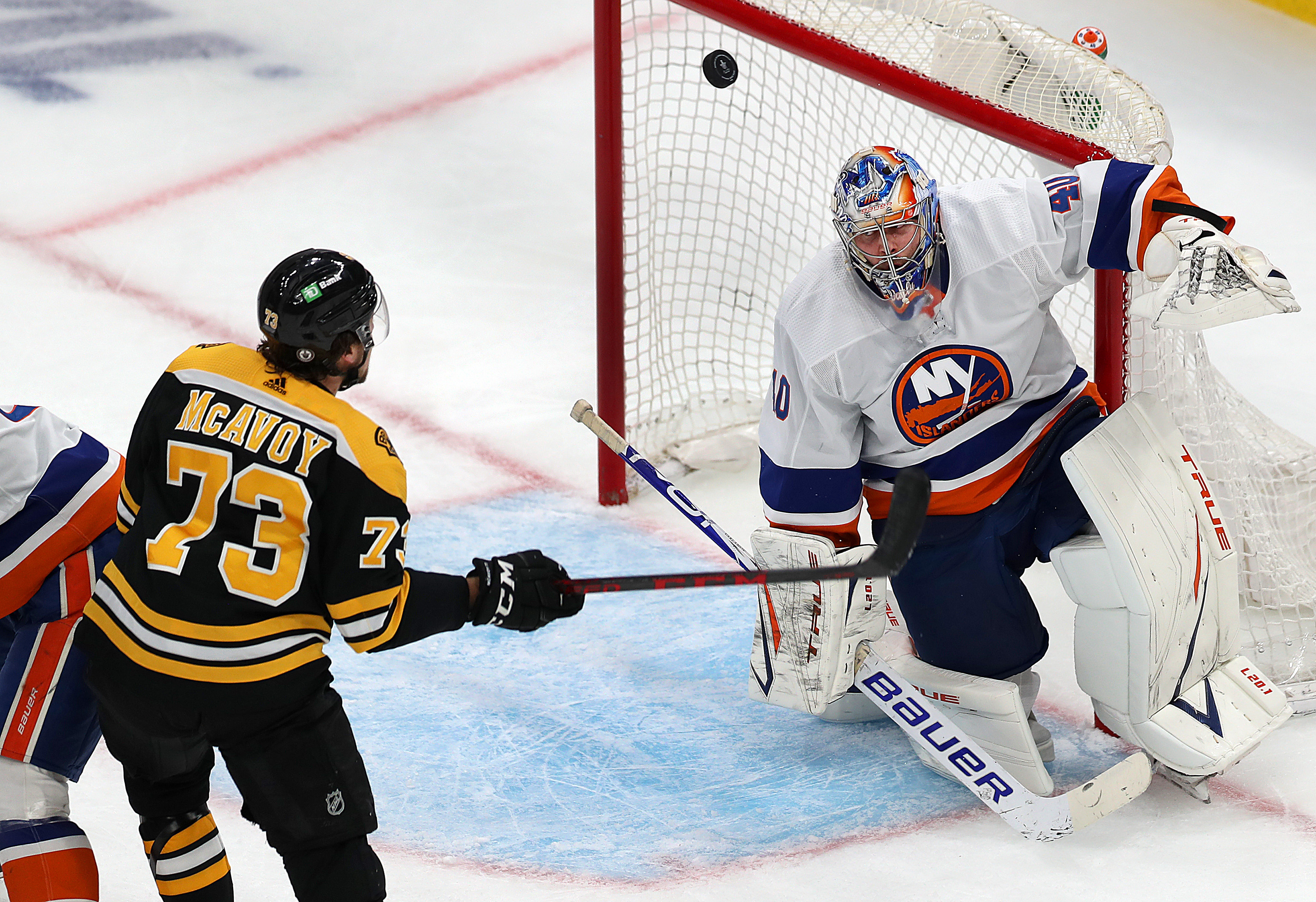 Charlie McAvoy can’t get a stick on a bouncing puck in the first period of Monday's game.