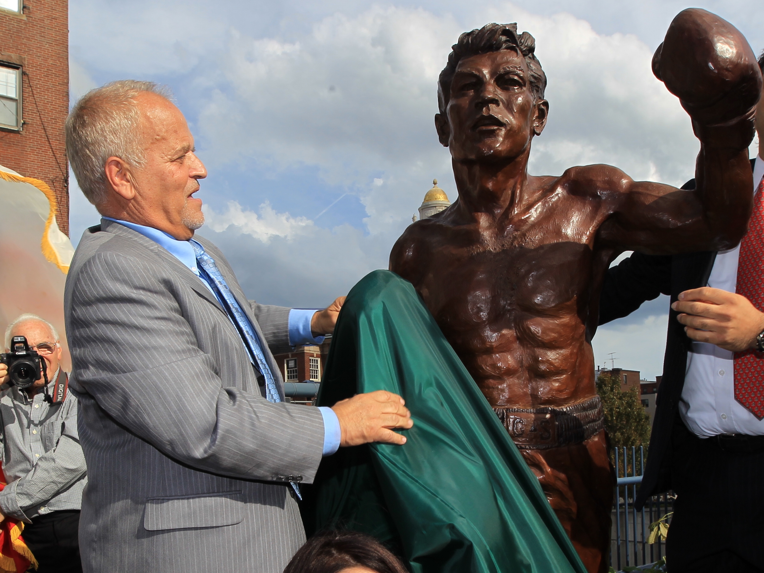 A statue was dedicated to Tony DeMarco (left) in the North End, his home neighborhood, in 2012.