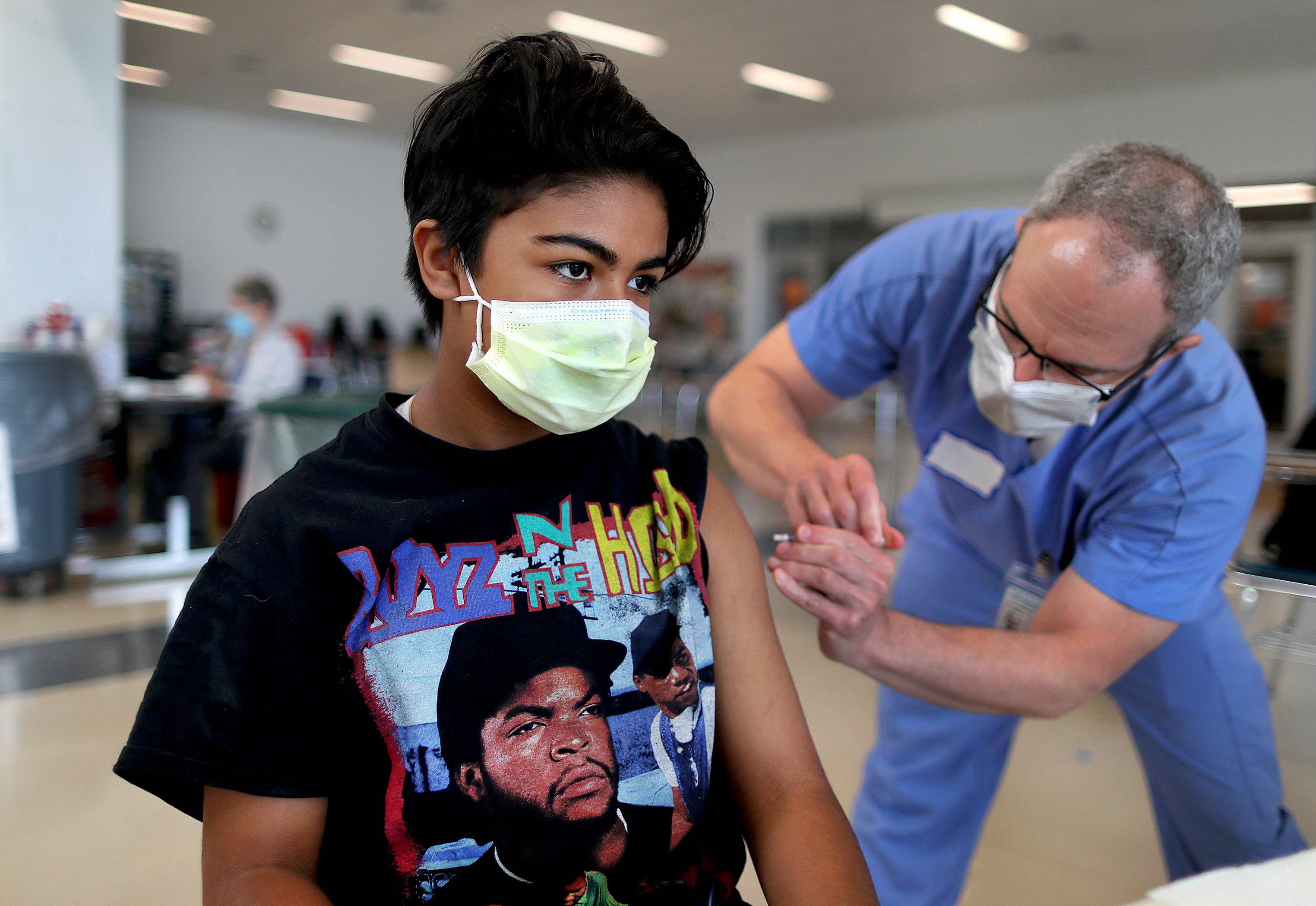 Selene Carvajal, 12, from Newton got her Pfizer vaccination from Dr. Michael Singer at Newton North High School.