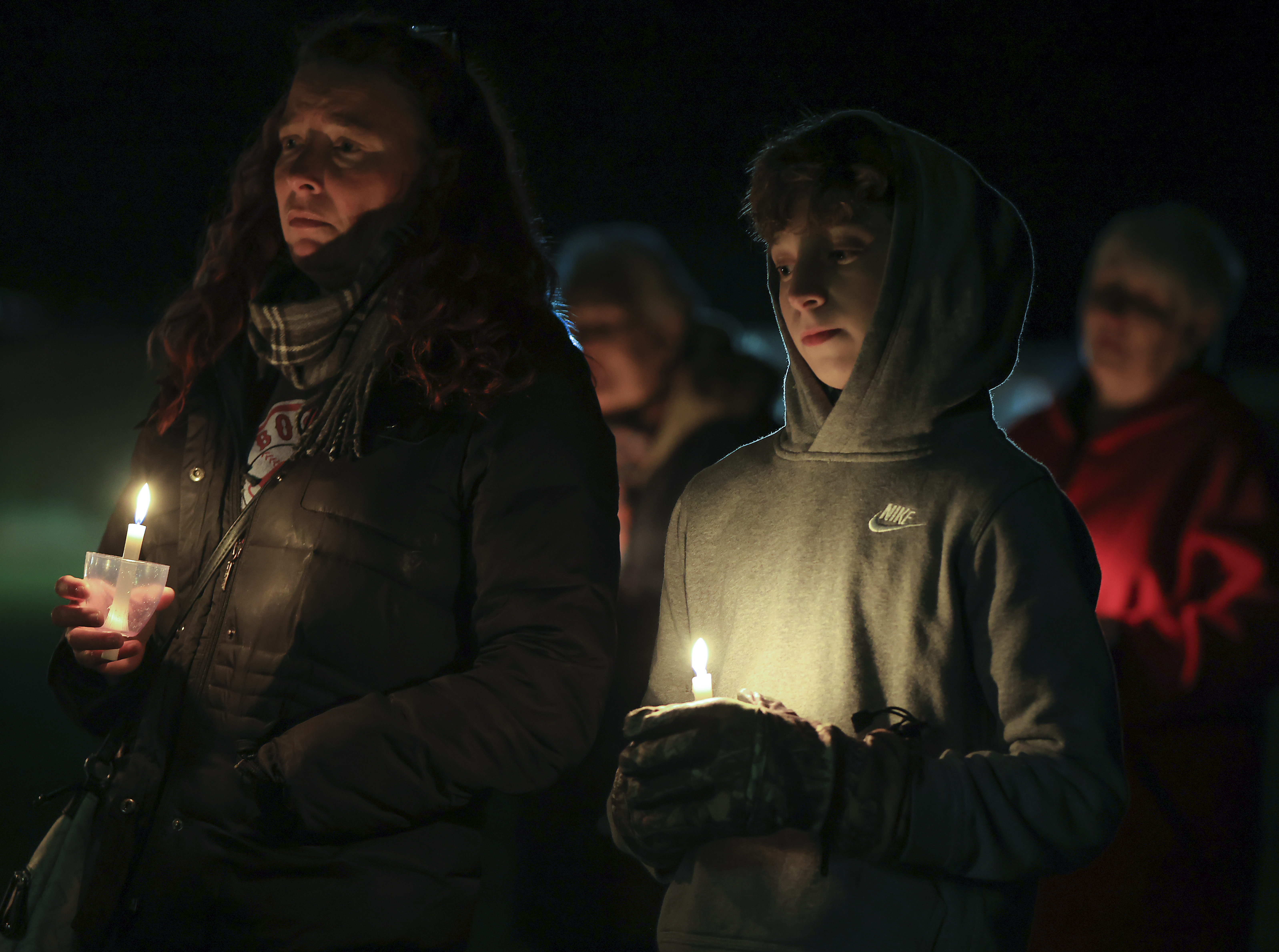 Boffi Therrien and her son Bryce Therrien, 12, attended a candlelight vigil at the Abington Town Hall for Elijah Lewis.
