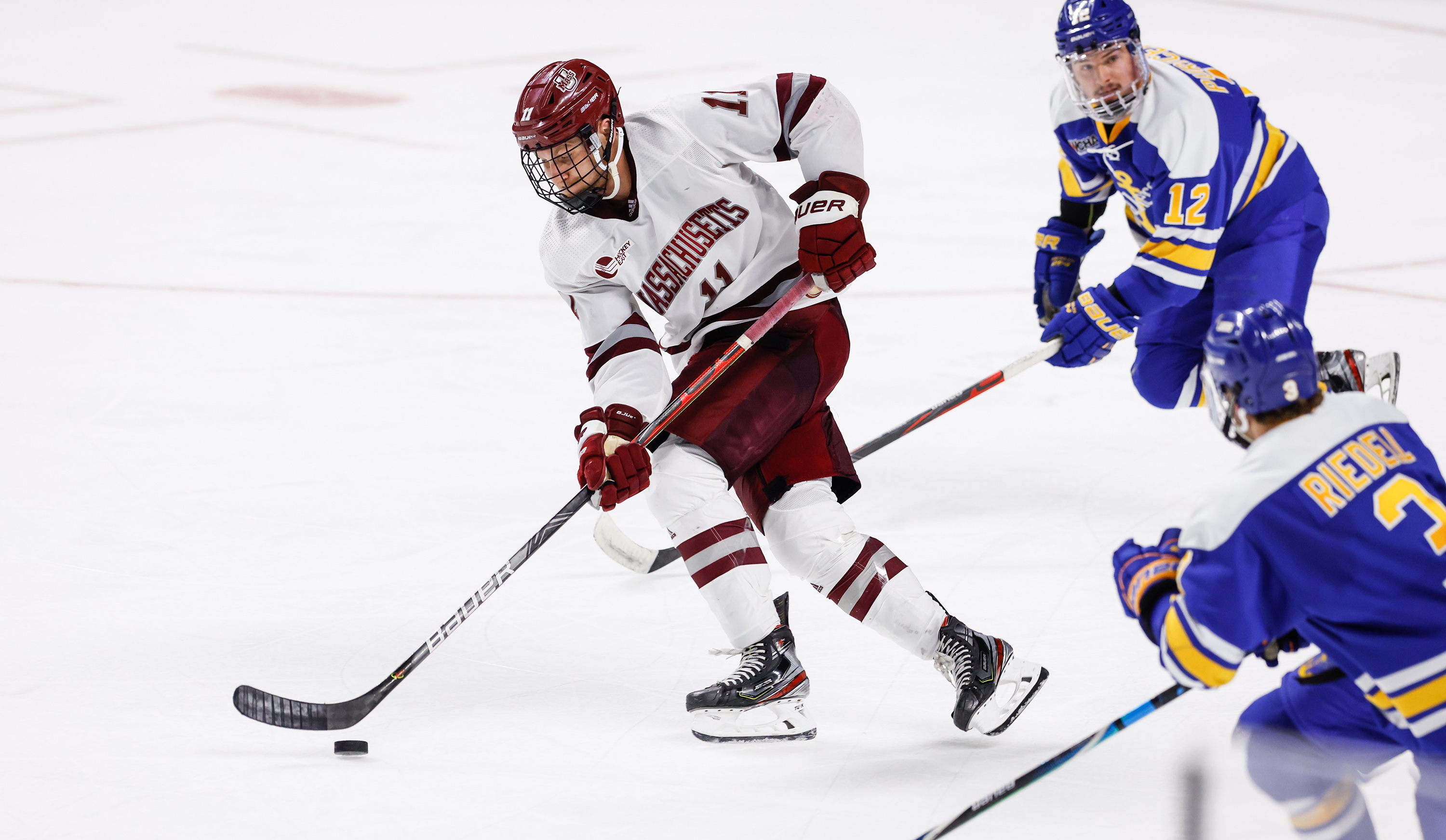 UMass forward Carson Gicewicz brings the puck up ice in a regional victory over Lake Superior State.