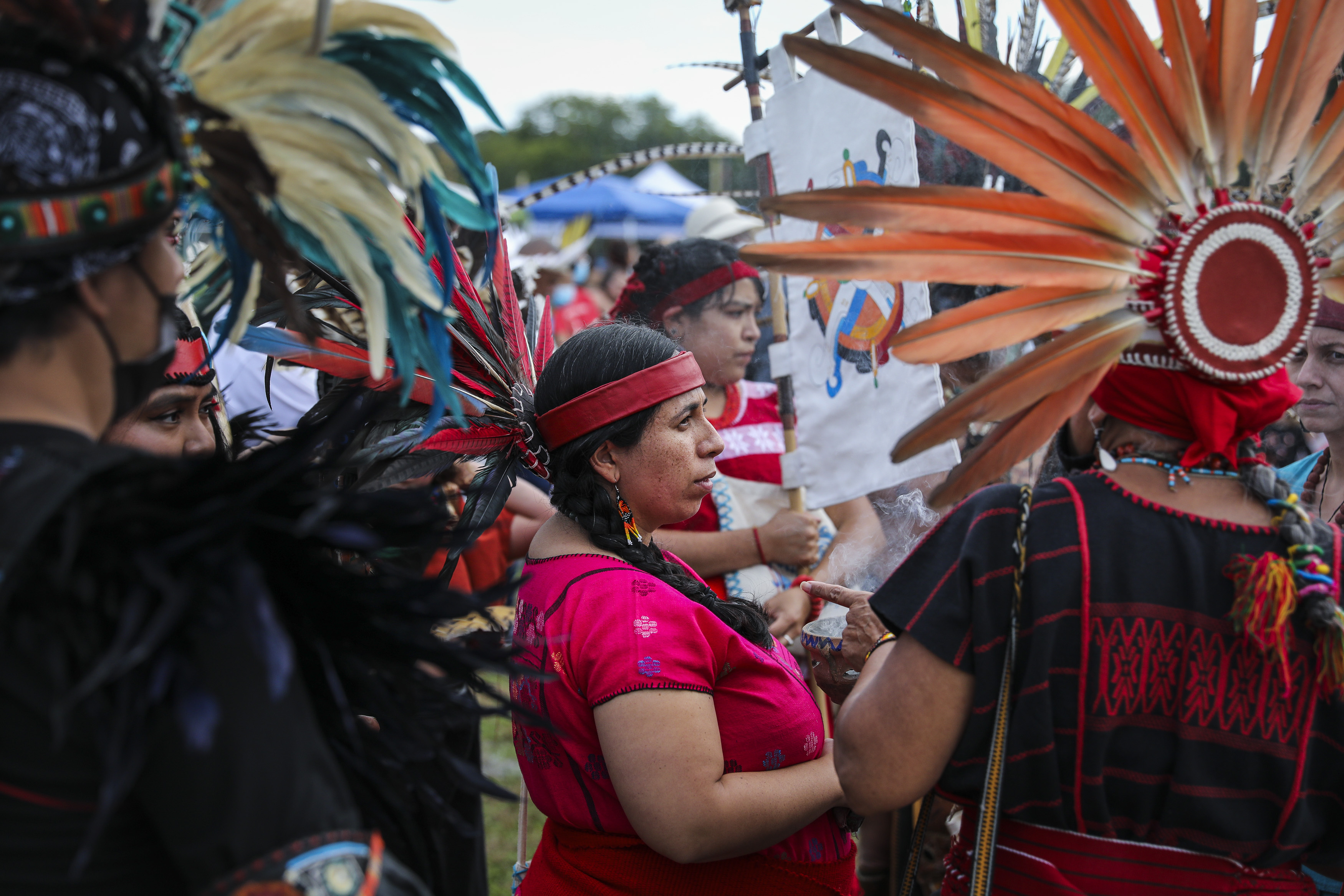 Aztec dancers from Cetiliztli Nauhcampa gathered before their ceremonial performance at the Indigenous Peoples Day Ceremonial Celebration.