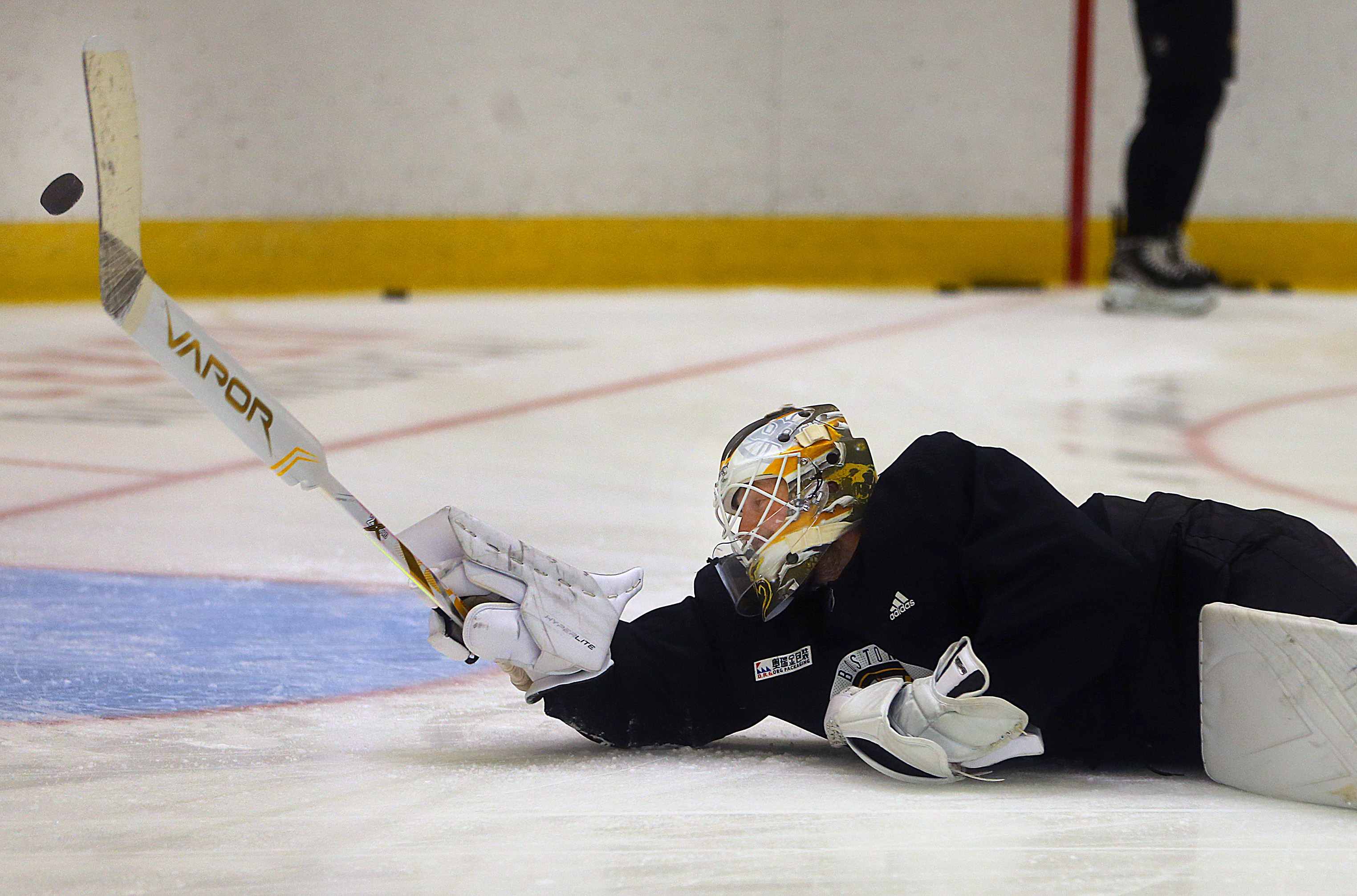 Linus Ullmark stretches to make a save during a recent workout in Brighton.