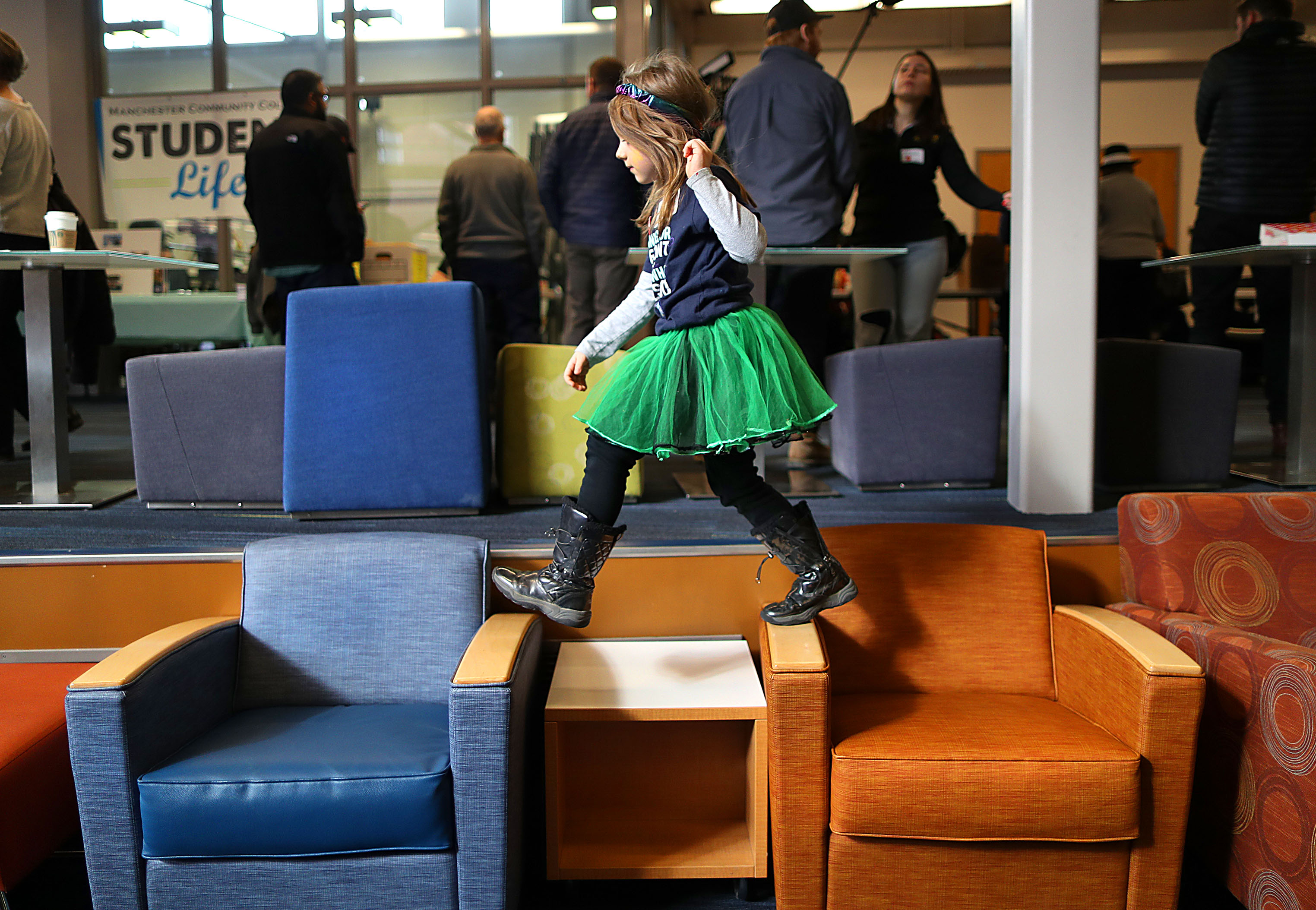 Rylee Mehung, 7, made the best of boredom while waiting for Senator Elizabeth Warren to rally with supporters at Manchester Community College in New Hampshire on Feb. 8.