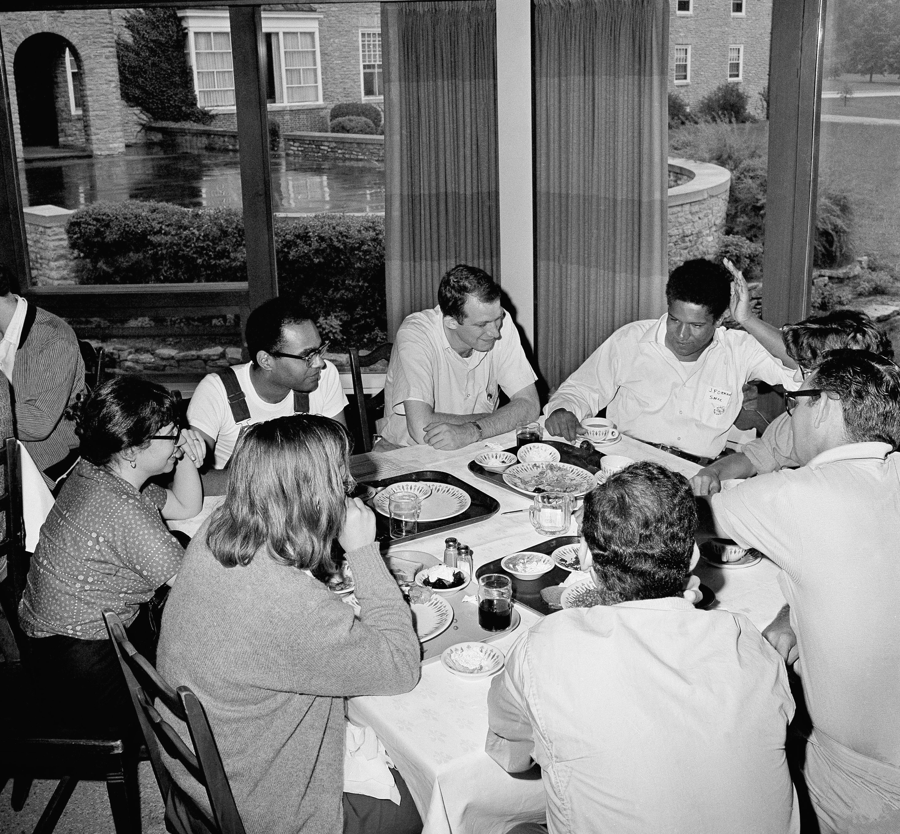 Mr. Moses (back left), at a meeting with voting rights activists including the Rev. Bruce Hanson (center) and James Forman, executive secretary of SNCC, in Mississippi. (AP Photo/Gene Smith)