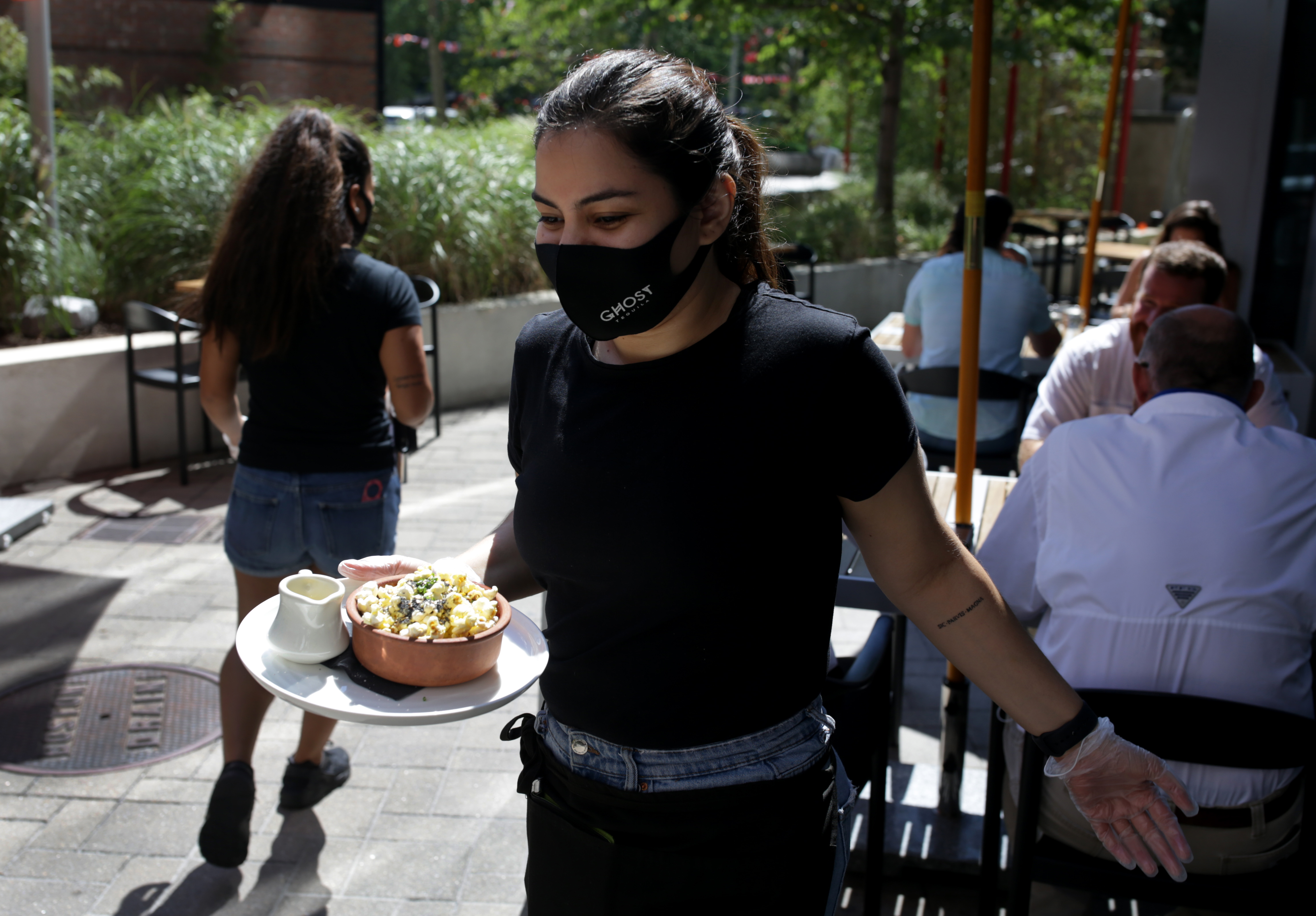 Food is taken to outside diners at Stillwater restaurant.
