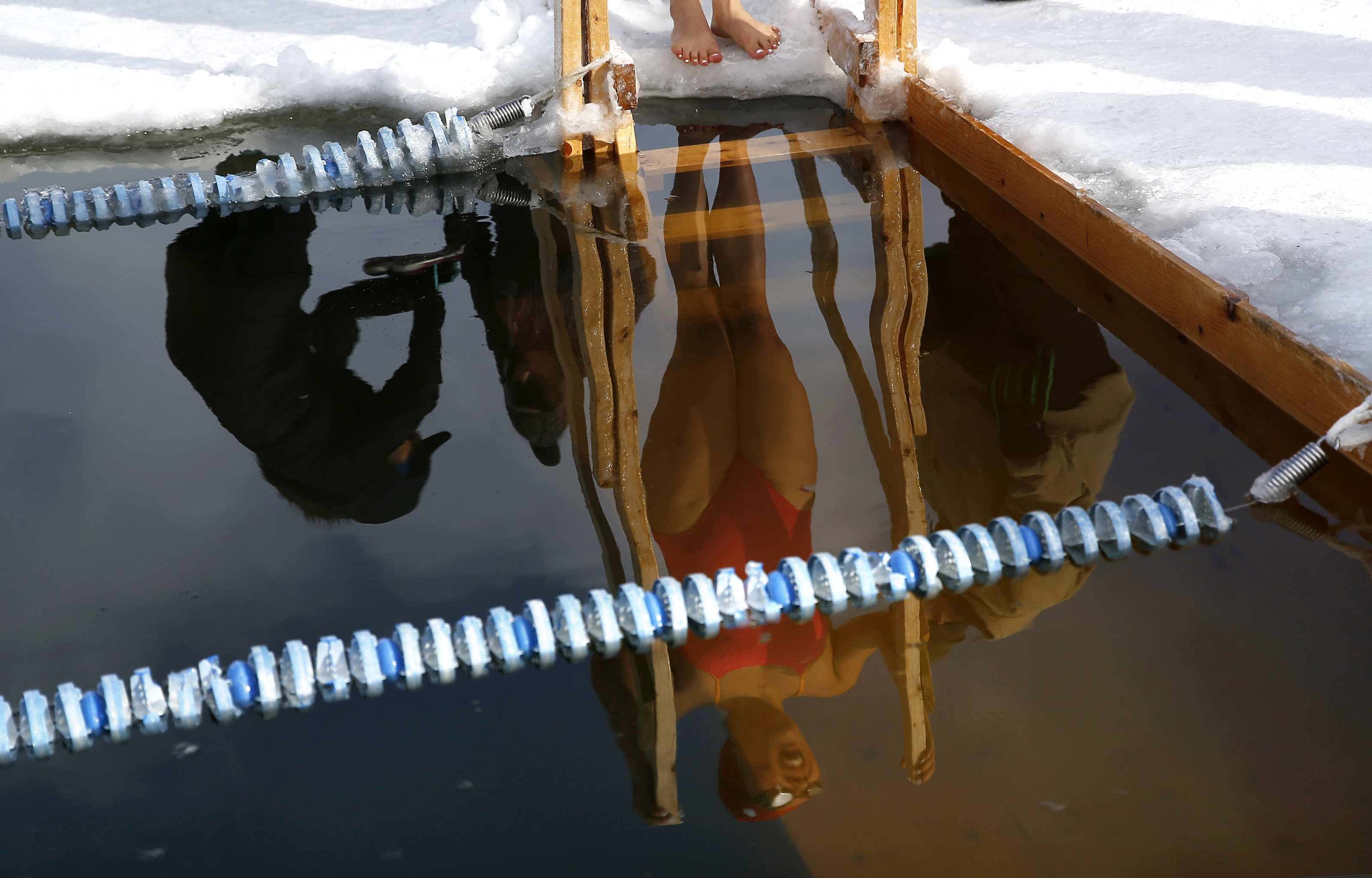 Qing Li of Chicago waited to compete in the 100-meter freestyle during the Winter Swim Festival.