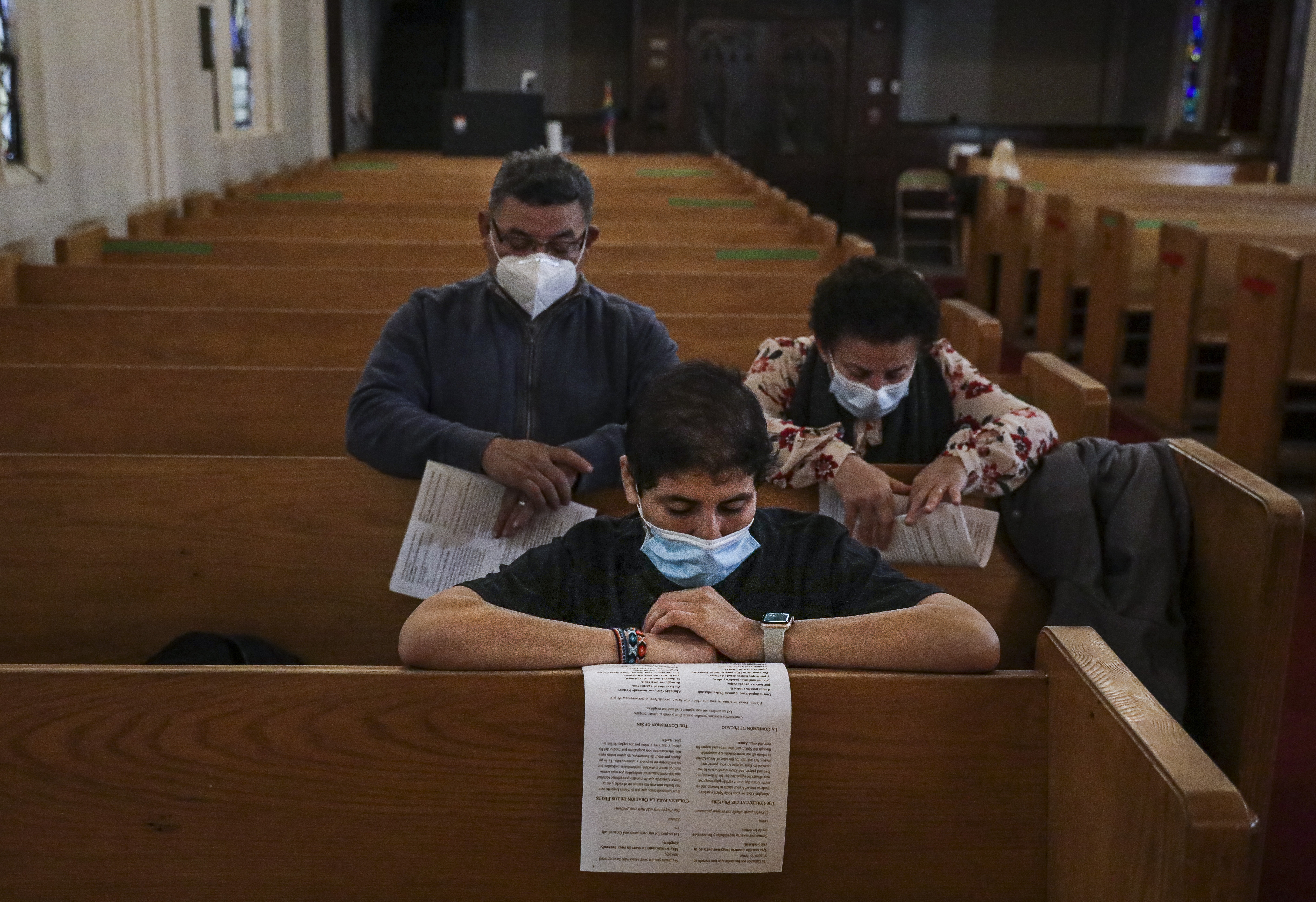 Congregants at St. Luke-San Lucas in Chelsea knelt to pray during a service Thursday.
