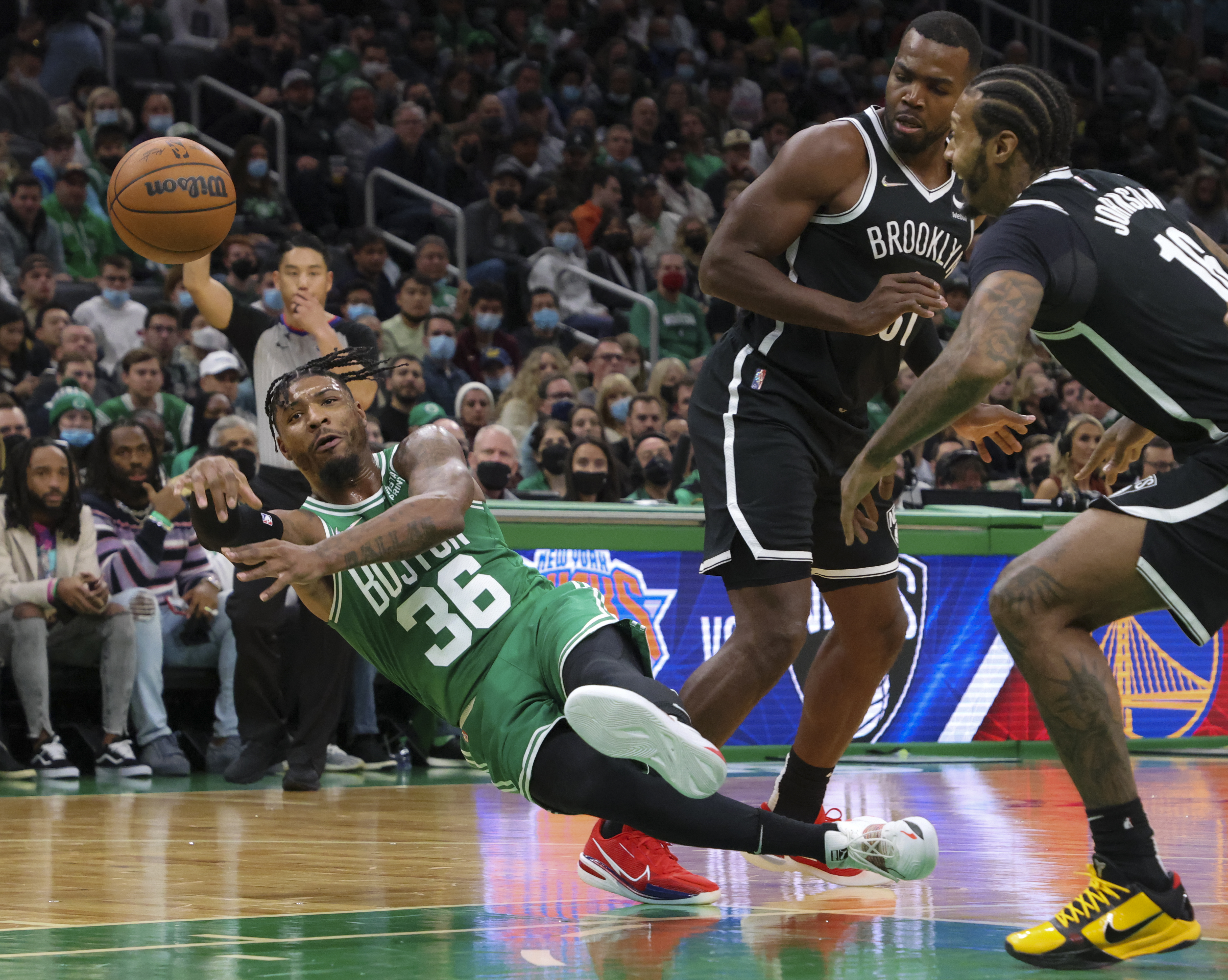 Marcus Smart is fouled by Brooklyn's James Johnson in the first quarter of Wednesday's loss.