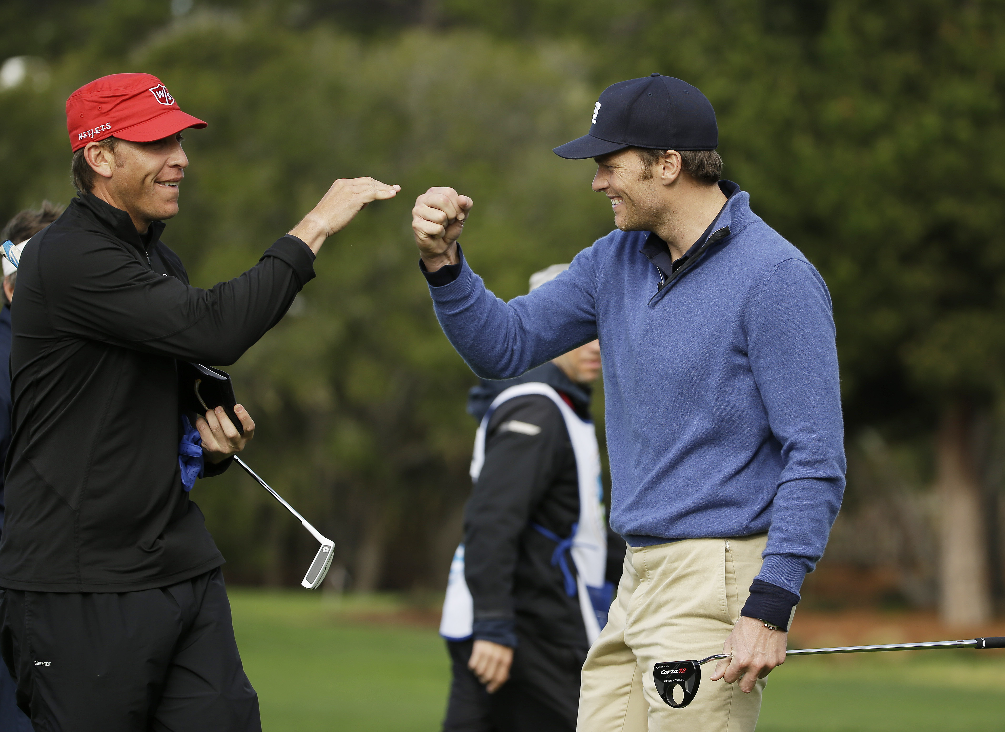 Tom Brady loves the links -- here he is in 2014 with Ricky Barnes after making a putt at the AT&T Pebble Beach Pro-Am.