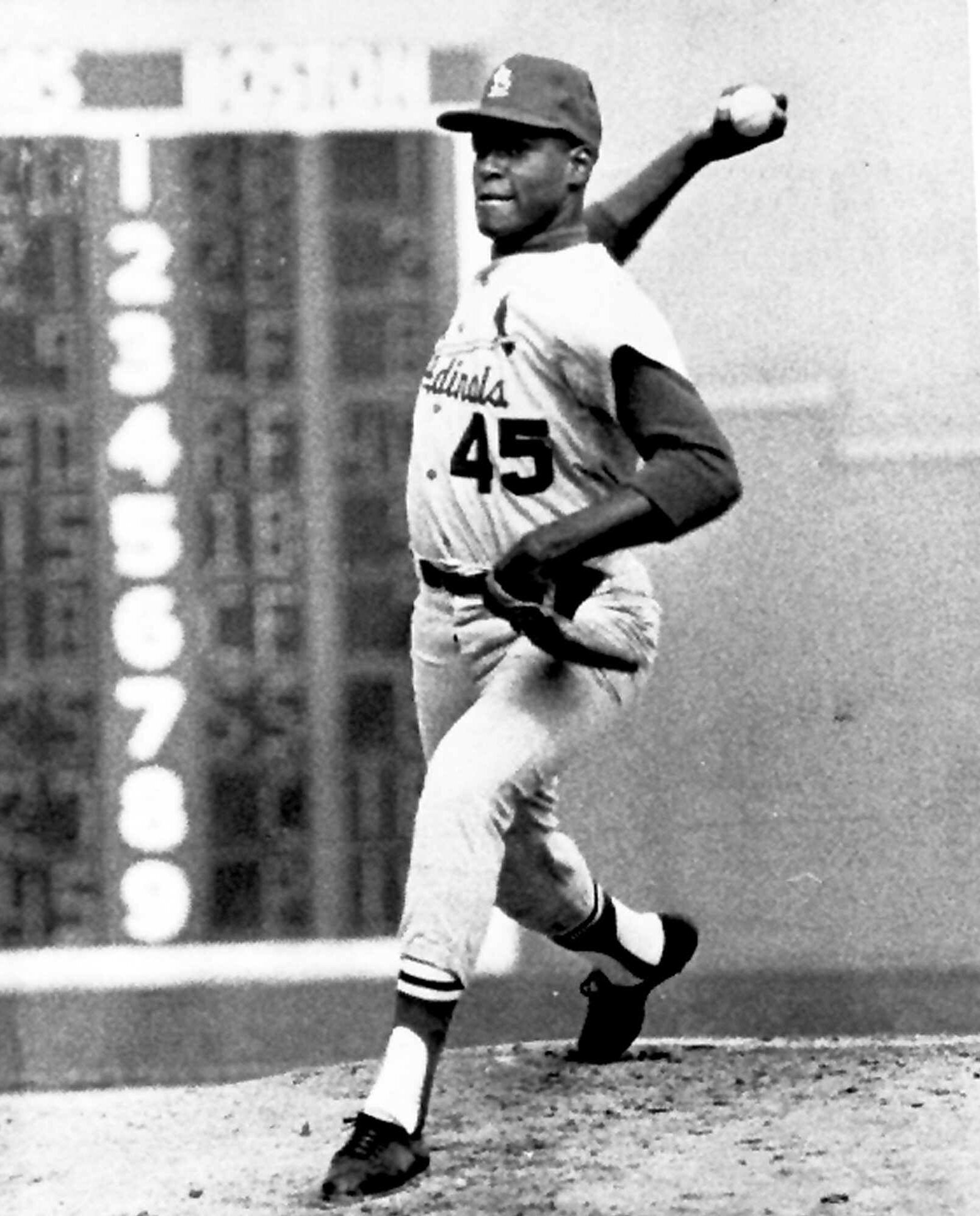 Bob Gibson pitches against the Red Sox on Oct. 12, 1967, during Game 7 of the World Series. He threw a three-hitter.