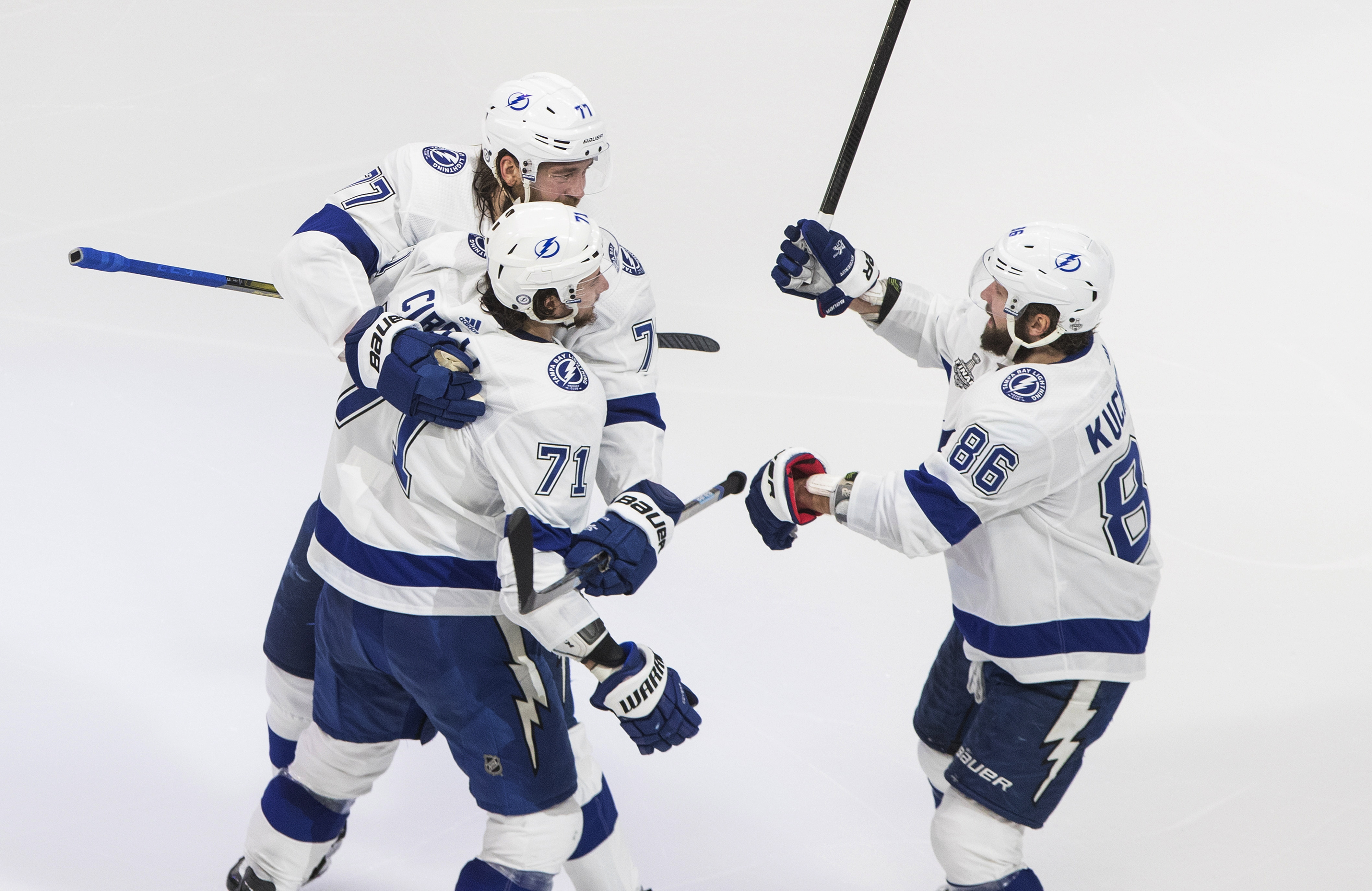 Tampa Bay's Victor Hedman (No. 77) celebrates his goal against Dallas with Anthony Cirelli (No. 71) and Nikita Kucherov (No. 86) Wednesday night.
