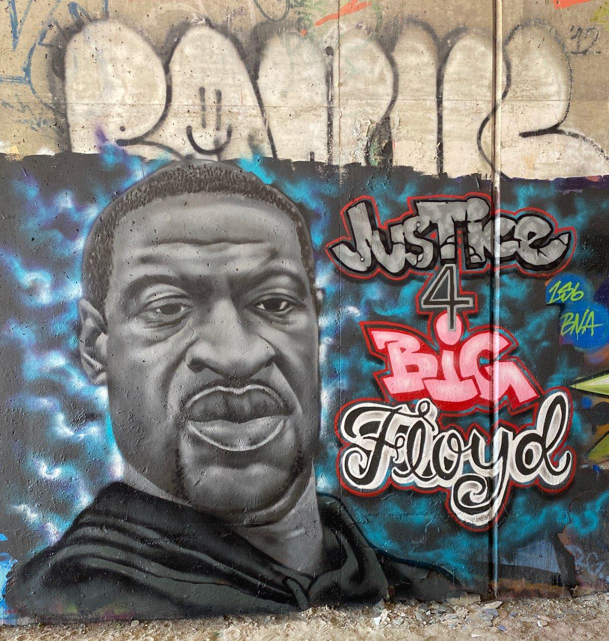 This is what the mural of George Floyd looked like before it was defaced.