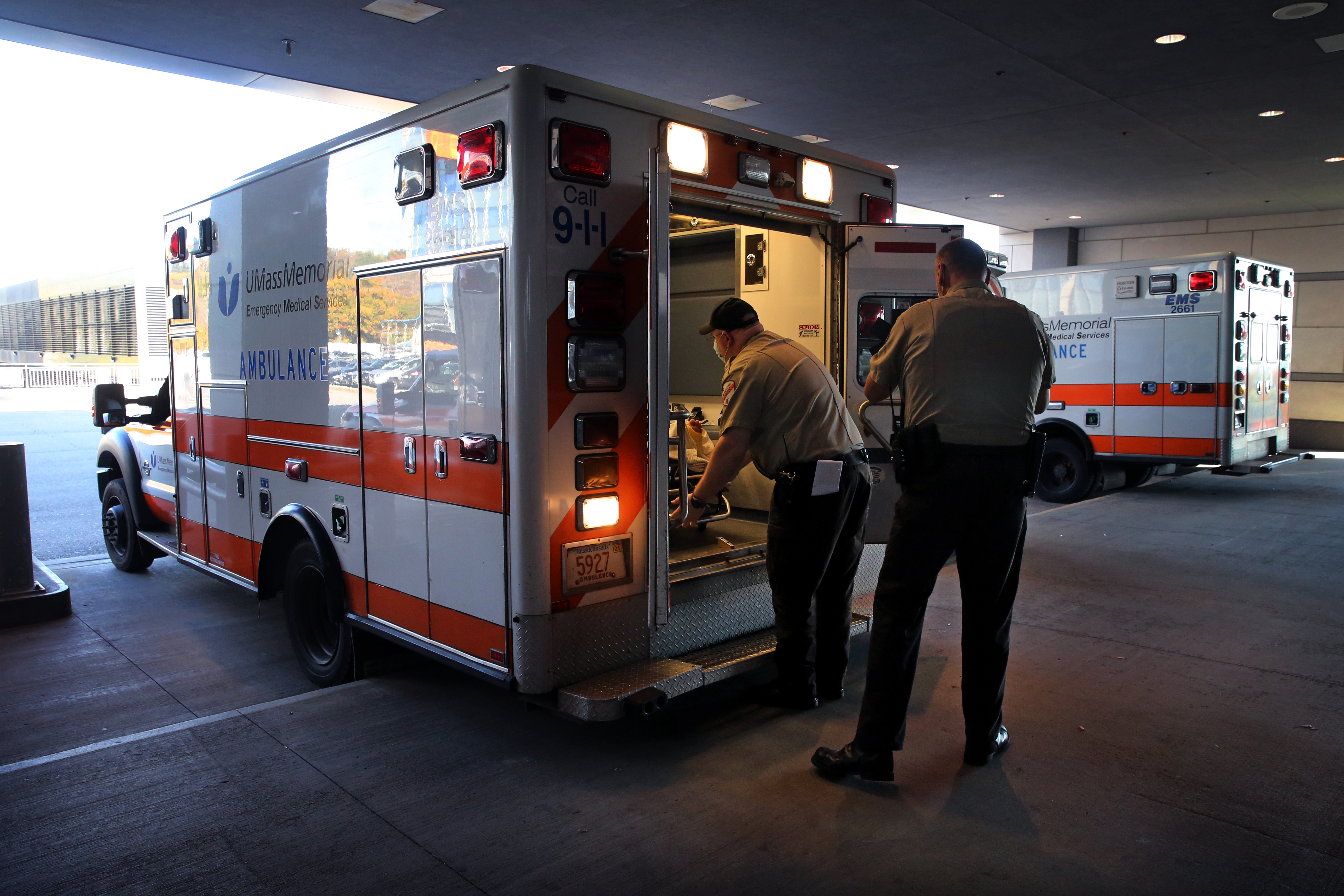 Paramedics Ronald Trudeau (left) and Paul Gomes arrive with a patient at the emergency department at UMass Memorial Medical Center in Worcester.