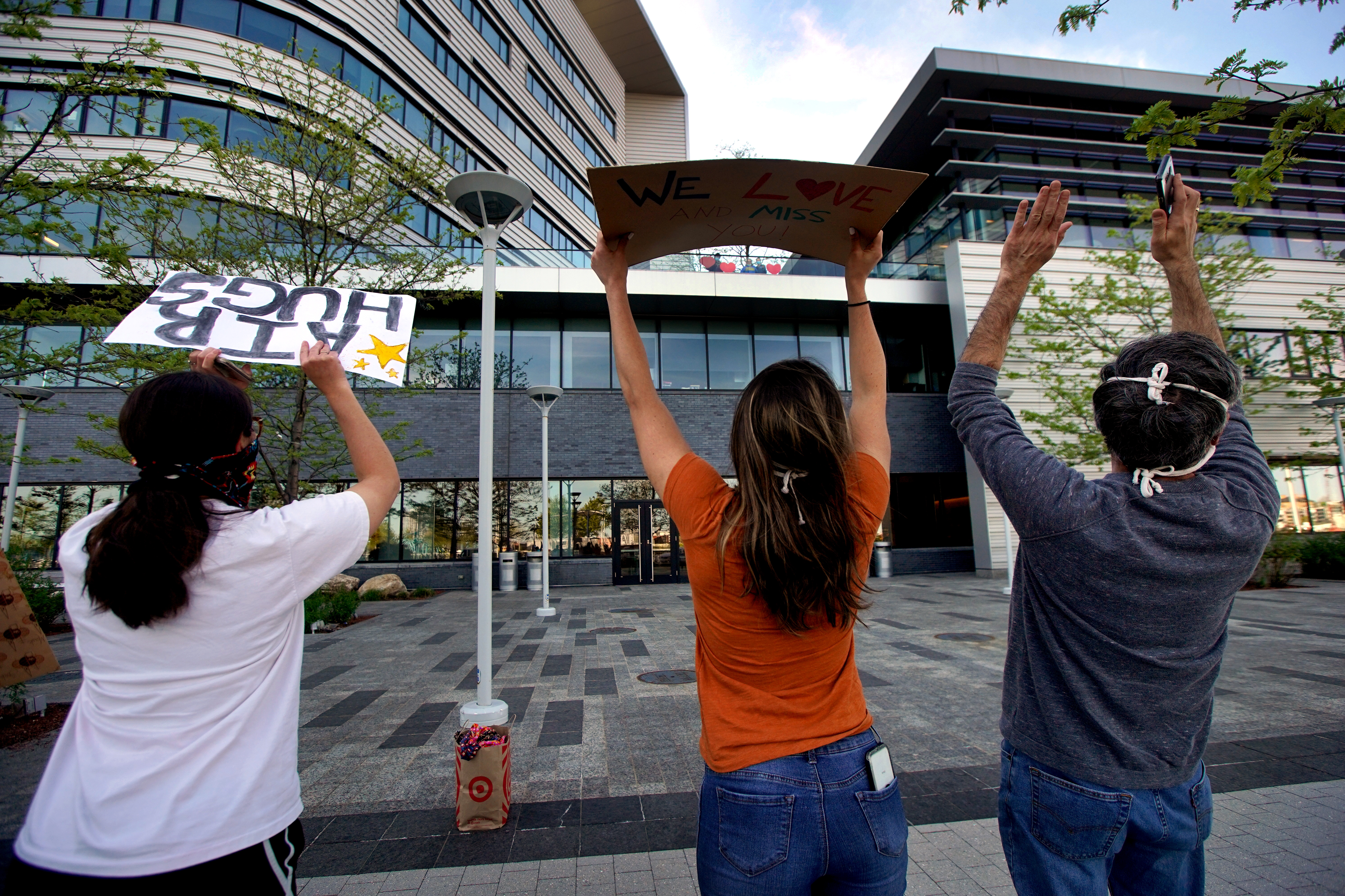 Nina's family and friends saluted her by doing the wave outside Spaulding while she watched from inside.