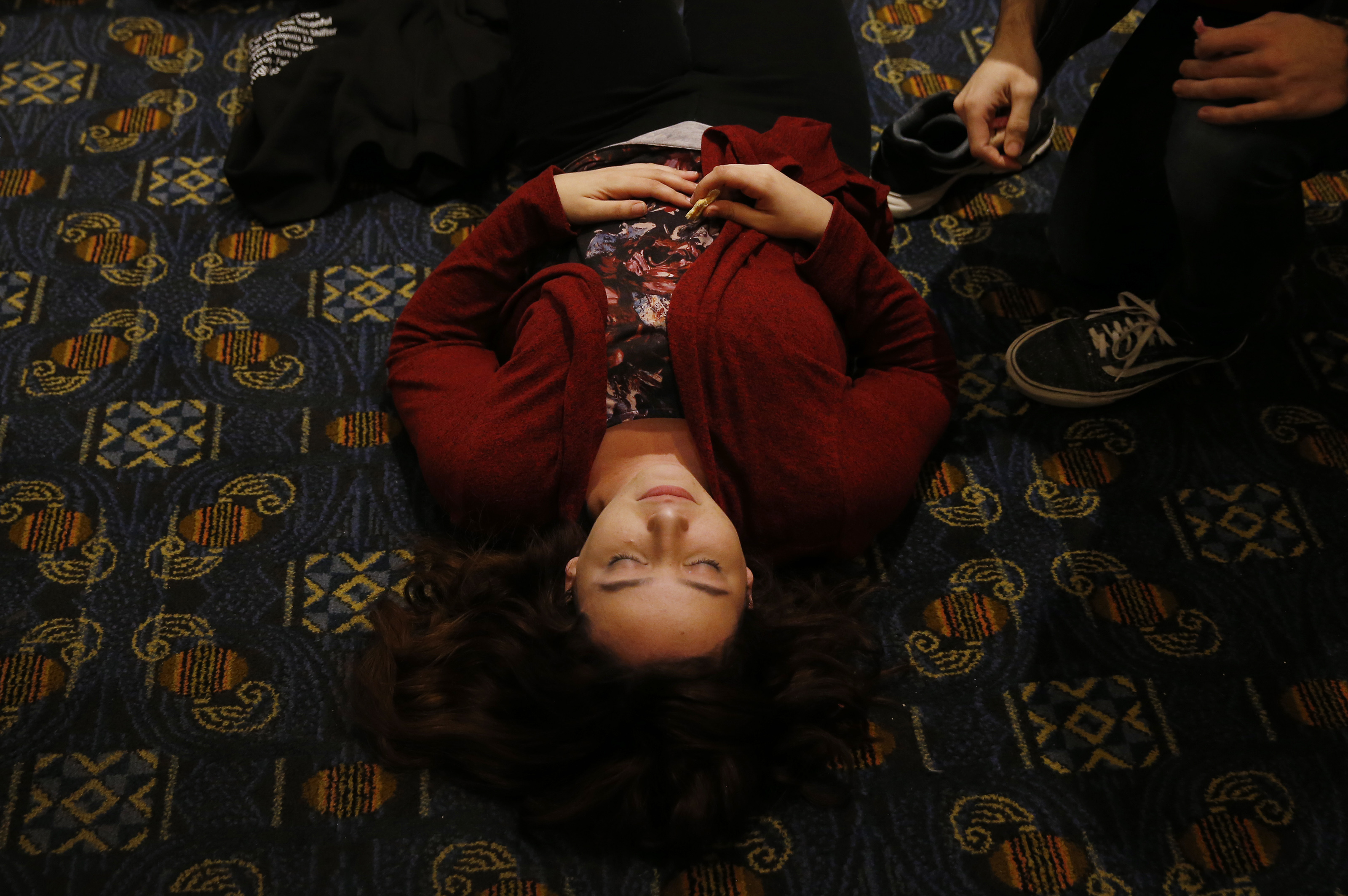 Backstage at the finals of the Massachusetts High School Drama Festival, Deb lay quietly on the floor, her hair spread out around her.