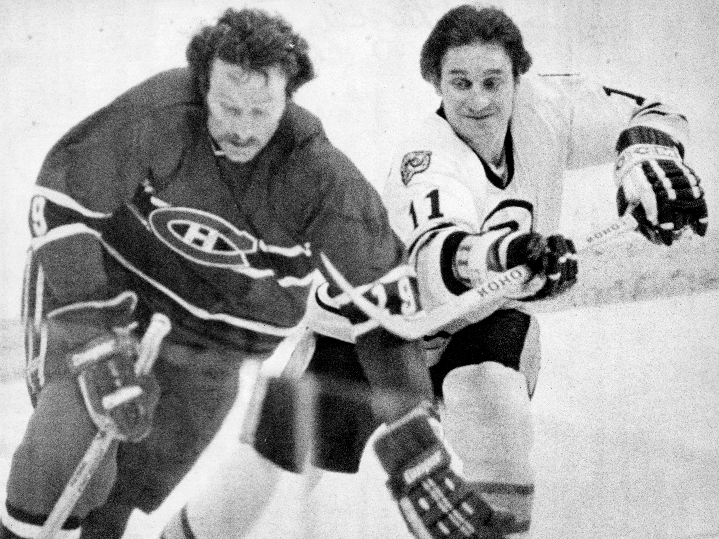 Bruins winger Bobby Schmautz (right) tangles with Larry Robinson of the archrival Canadiens during a playoff game in 1979.

