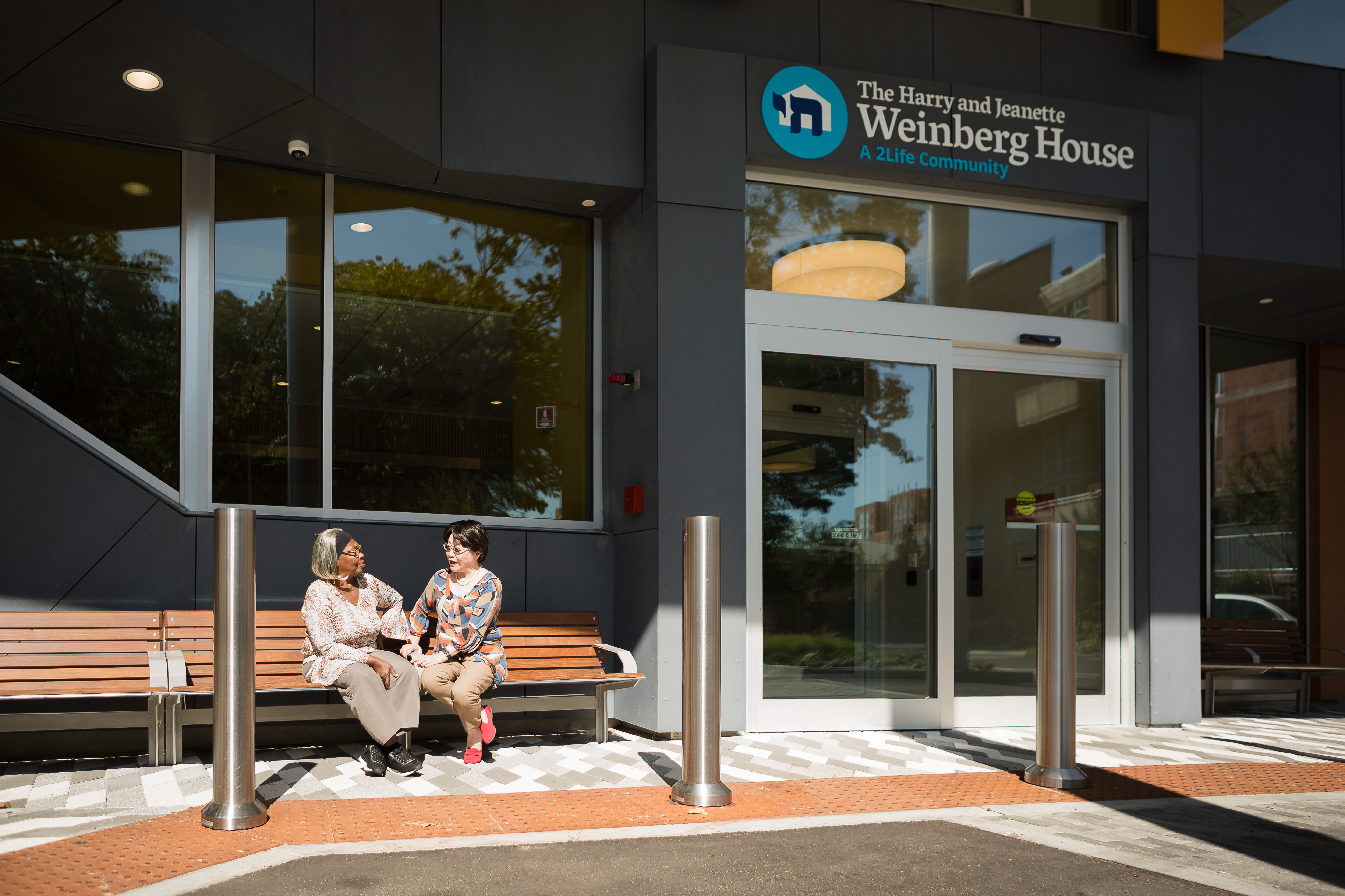 Two Weinberg House residents talk together in Brighton, MA.