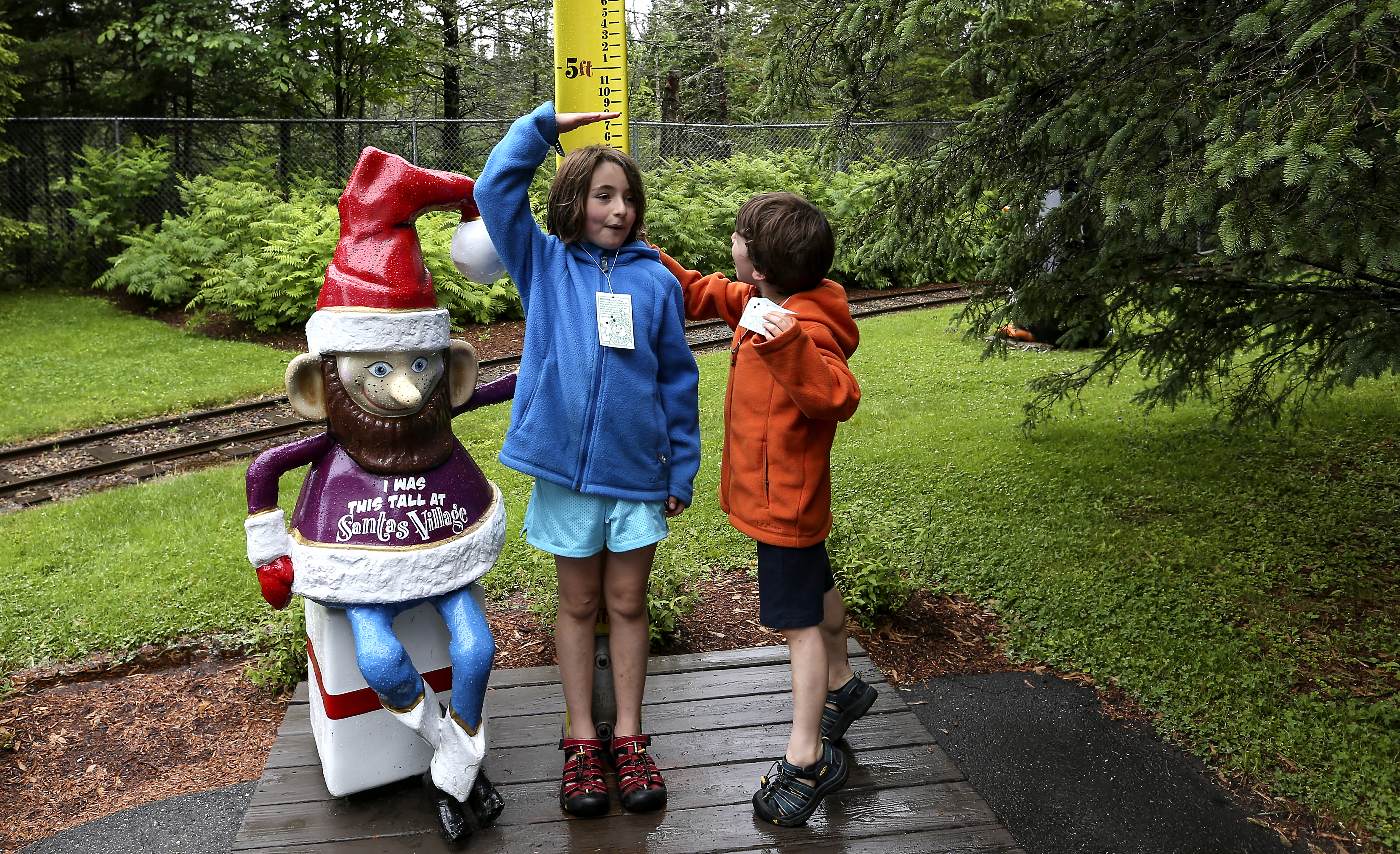 Children measured their height at Santa's Village in Jefferson, N.H.