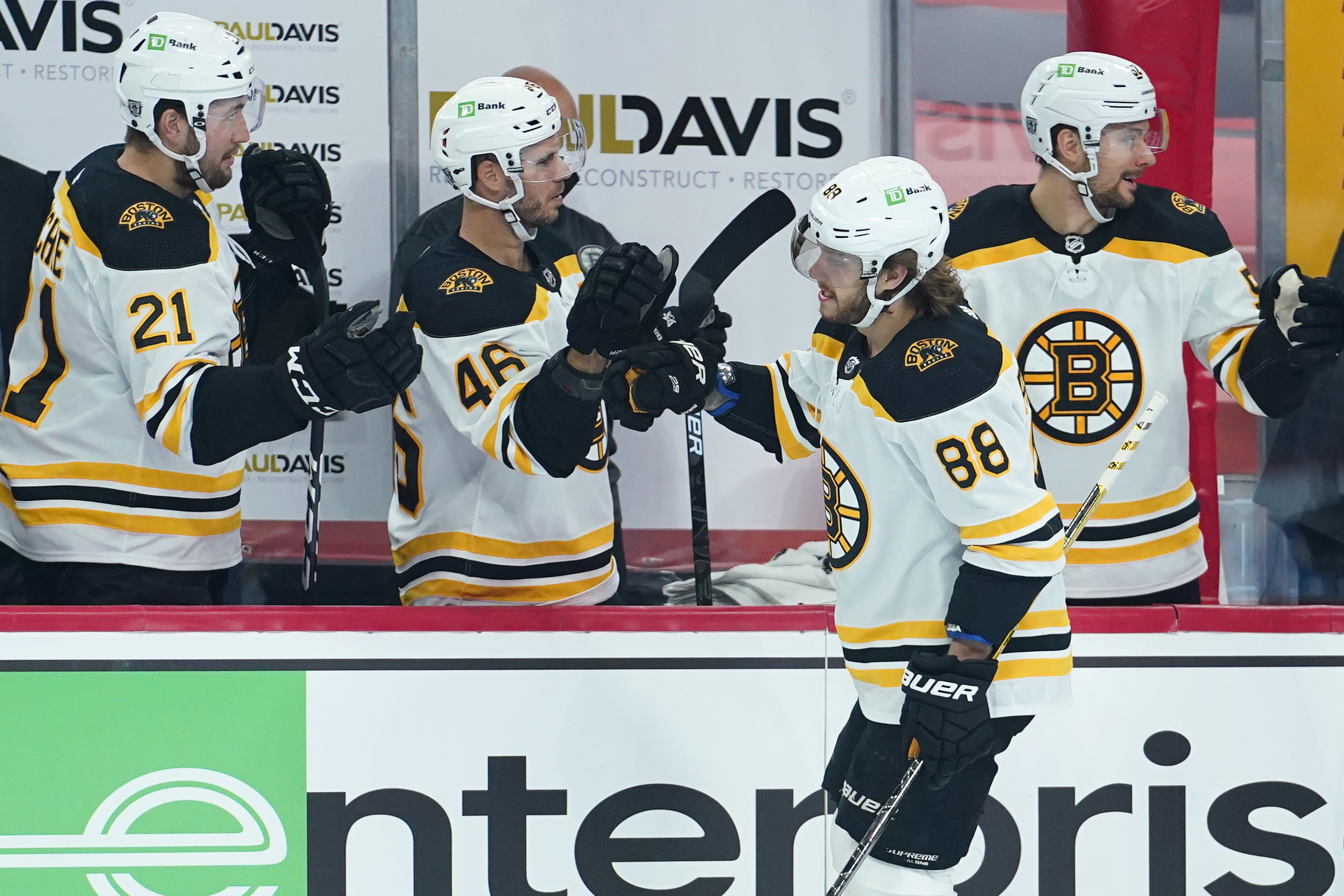 David Pastrnak celebrates with teammates during Wednesday's win over Philadelphia.