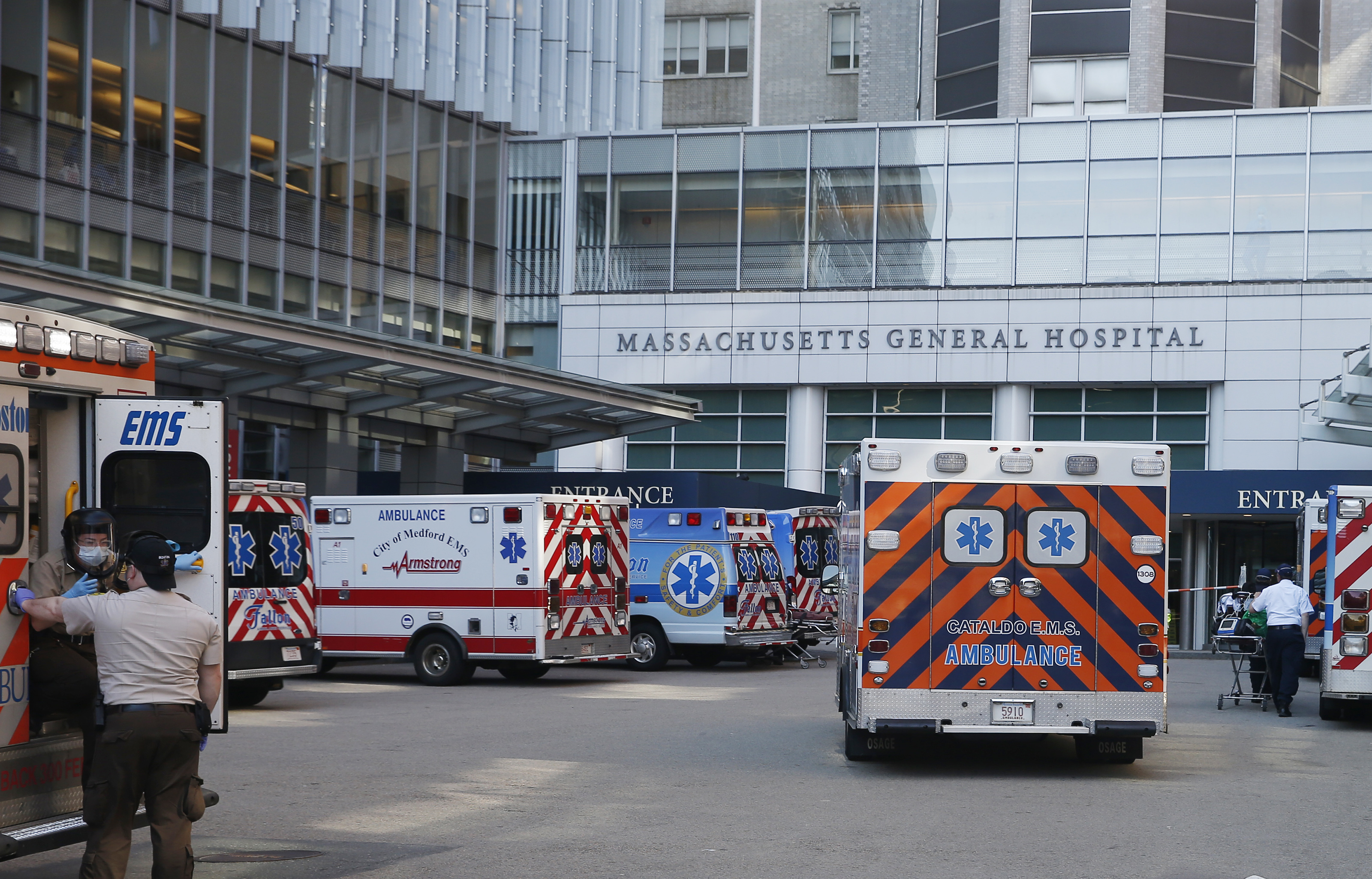 Monday, 4:05 p.m. Emily and Ricky drove into a parking lot crowded with ambulances outside of Mass. General Hospital as they transported a patient from MGH Chelsea Urgent Care who was exhibiting COVID-19 symptoms.