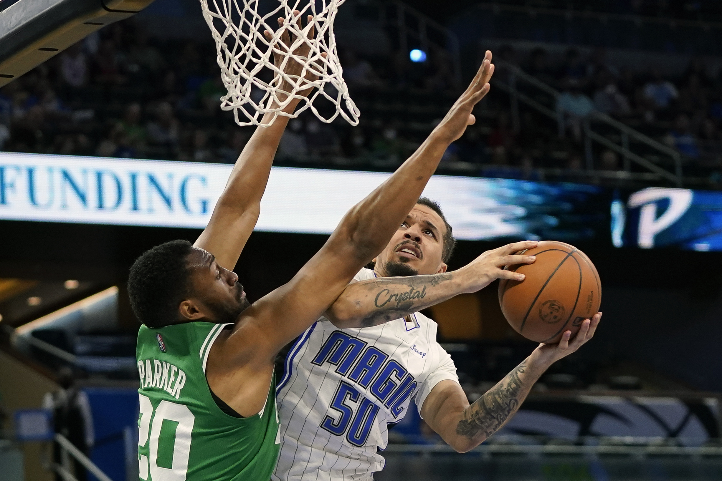 Jabari Parker defends against Orlando's Cole Anthony in the first half of Wednesday's exhibition contest.