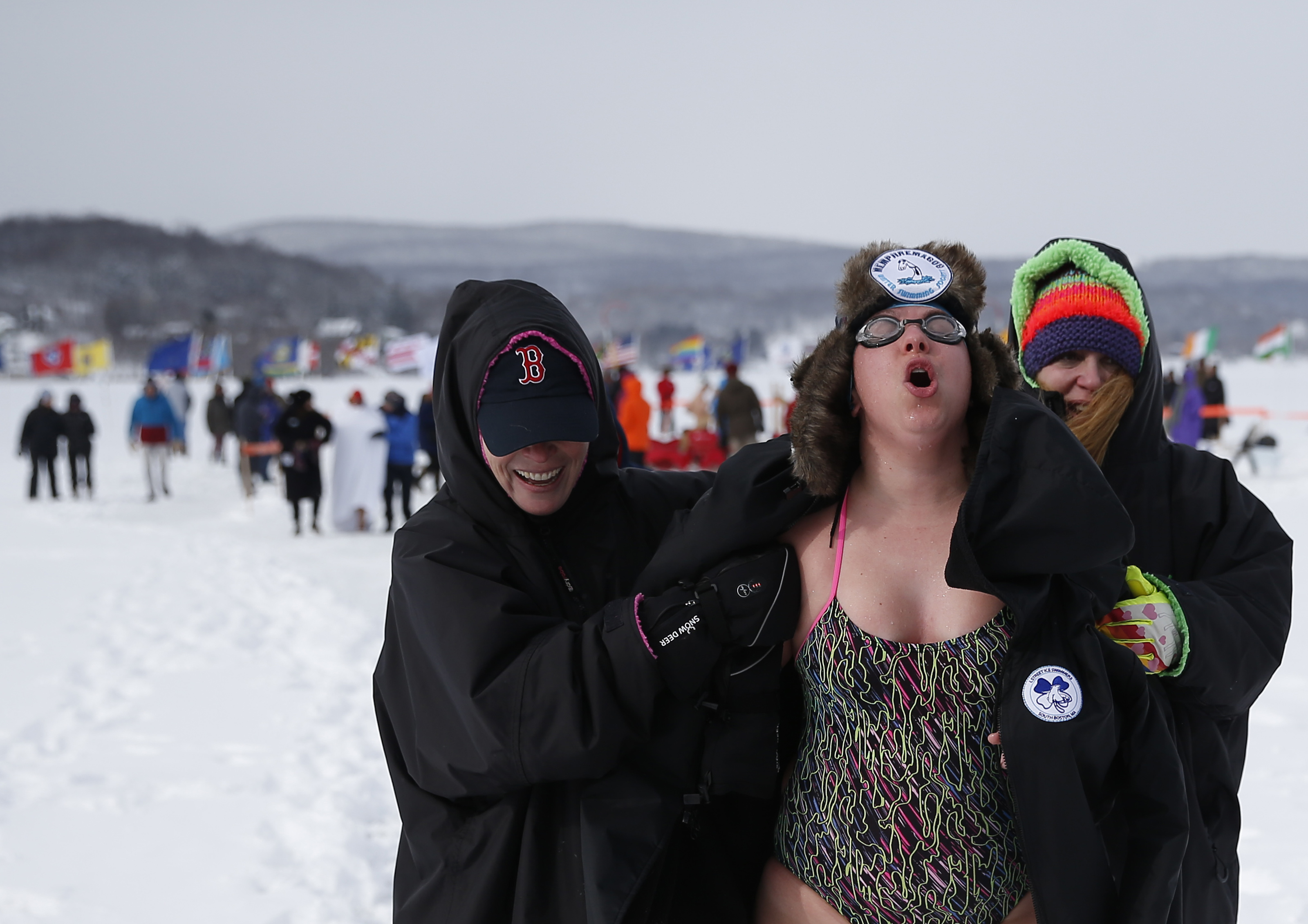 Sam Levinson celebrated as she was escorted to the warming hut by fellow L Street swimmers after her race.