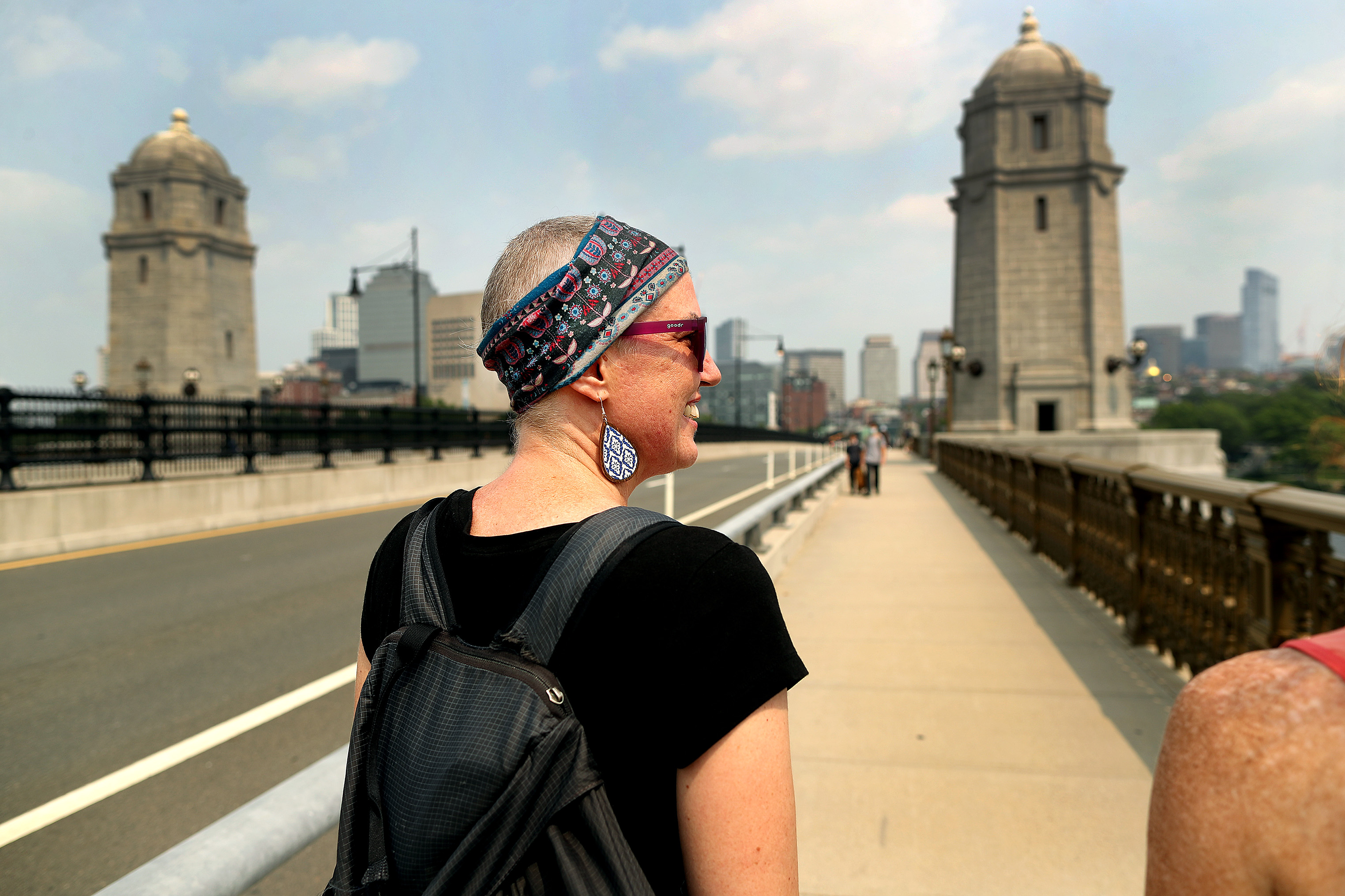 Carlin Carr walked across the Longfellow Bridge to MGH with friends on her last day of treatment.