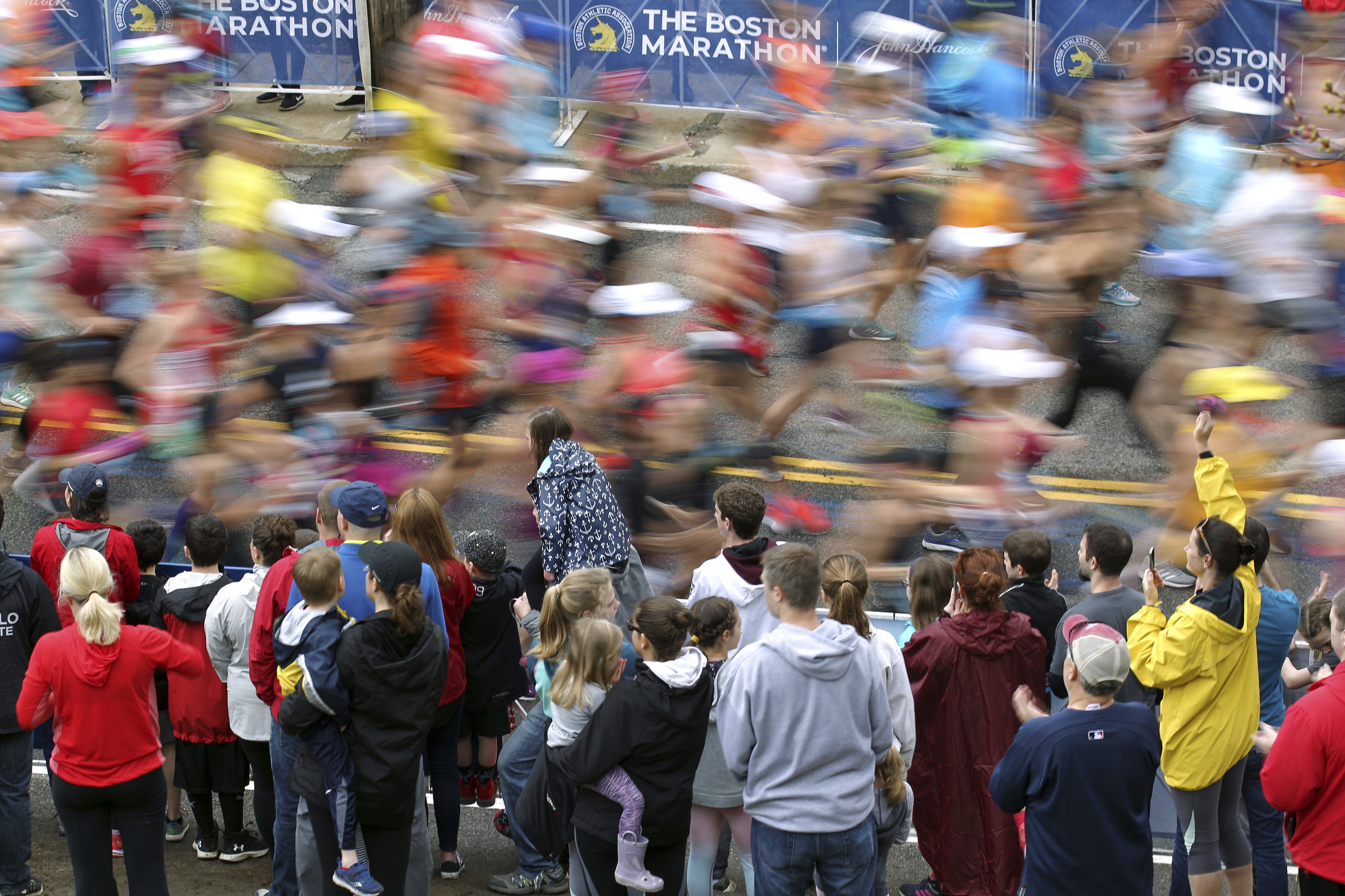 Fans cheer on runners during the 2019 Boston Marathon.