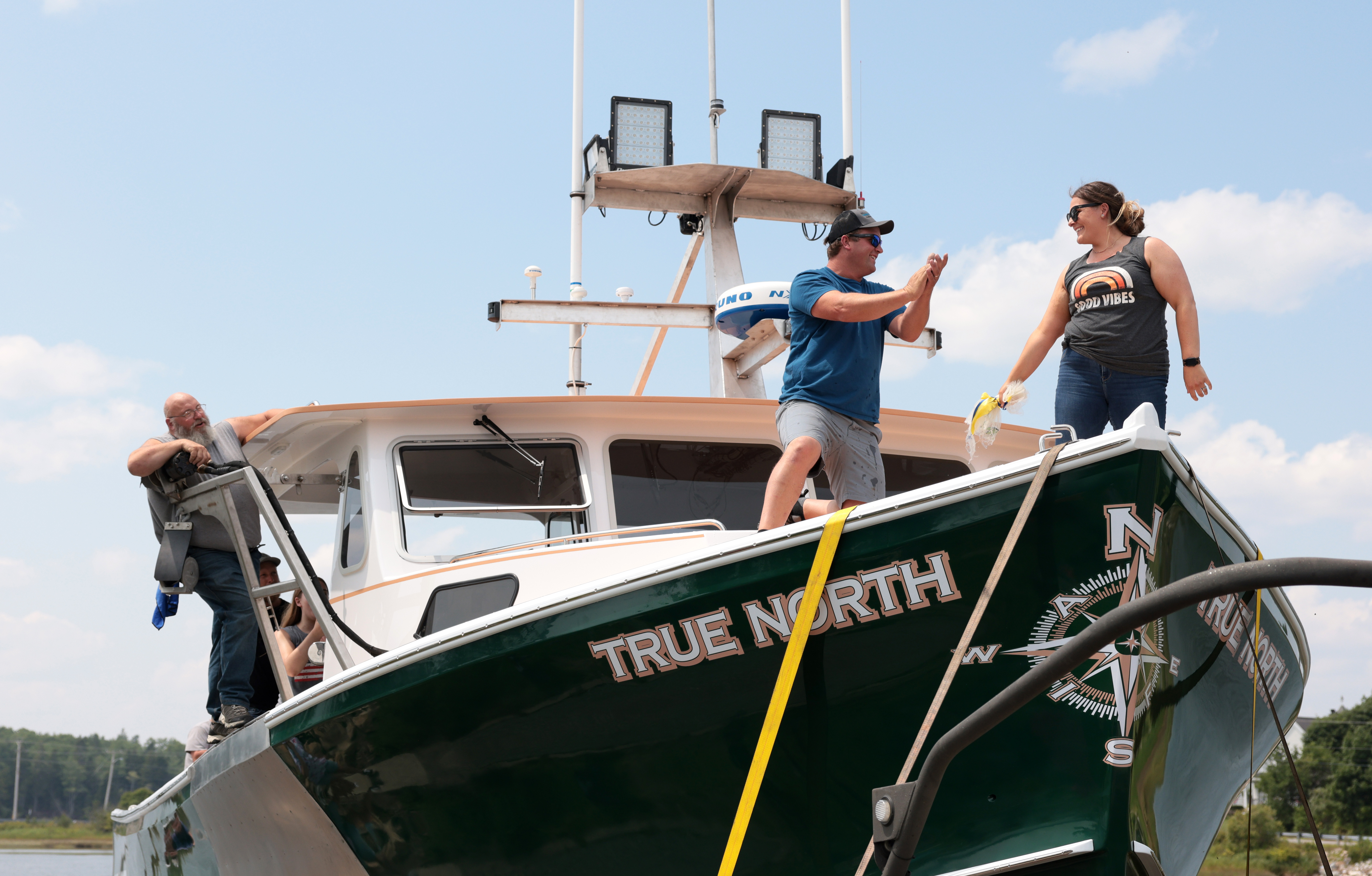 Johnny McCarthy applauded his wife, Ali, after she christened his new boat, True North, in Milbridge, Maine, on July 27. “For a fisherman, launching a new boat is like having a baby,” McCarthy says. “It’s something a guy like me is lucky to do even once. ... On launch day, I don’t want to worry about tomorrow.” 