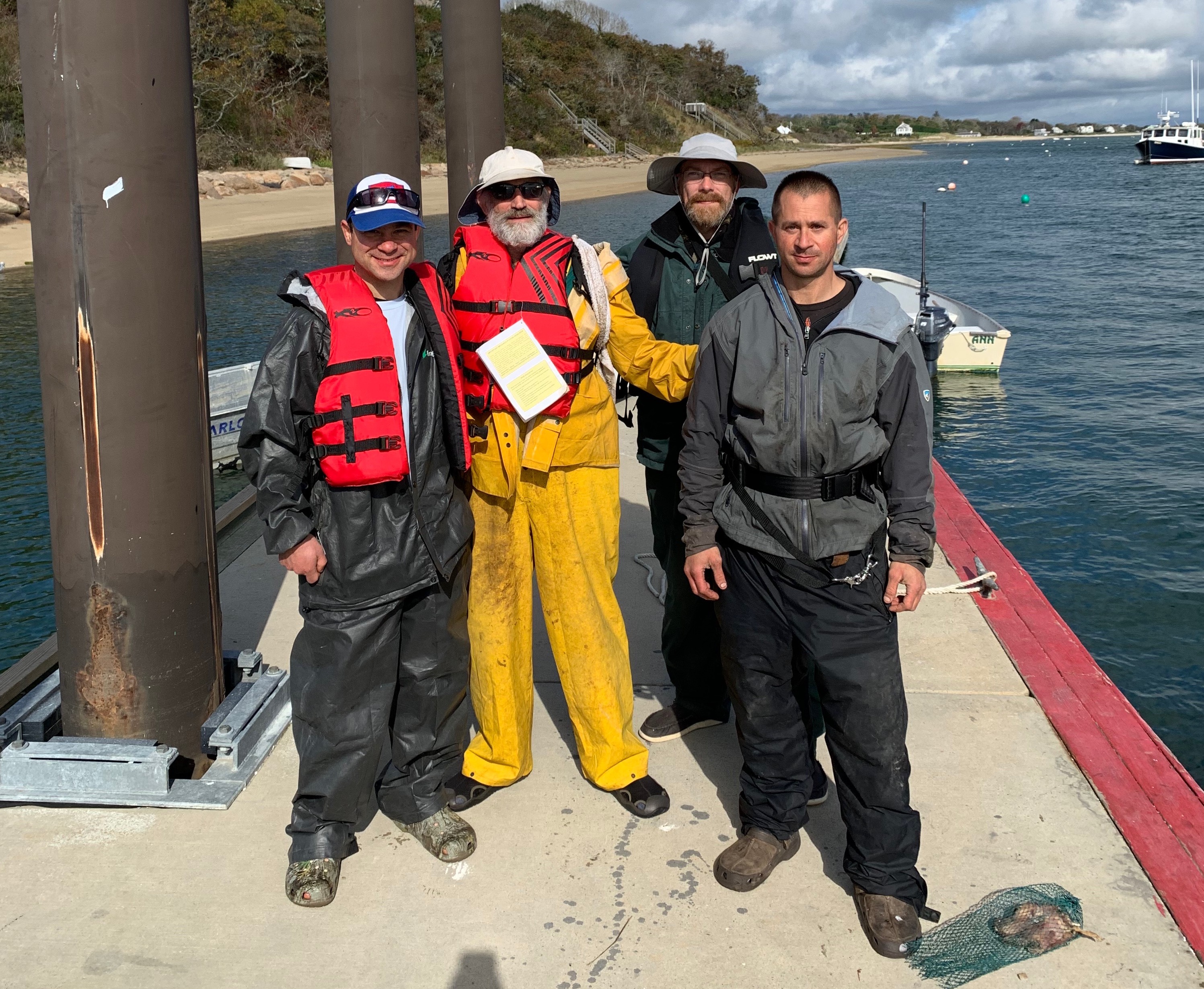 Four men were rescued off the coast of Chatham Saturday morning when their boat began taking on water.